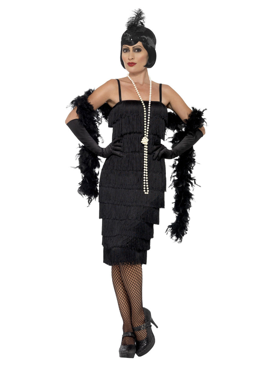 Plus size woman modeling a black 1920s fringed flapper costume with matching feather headband and long black gloves.