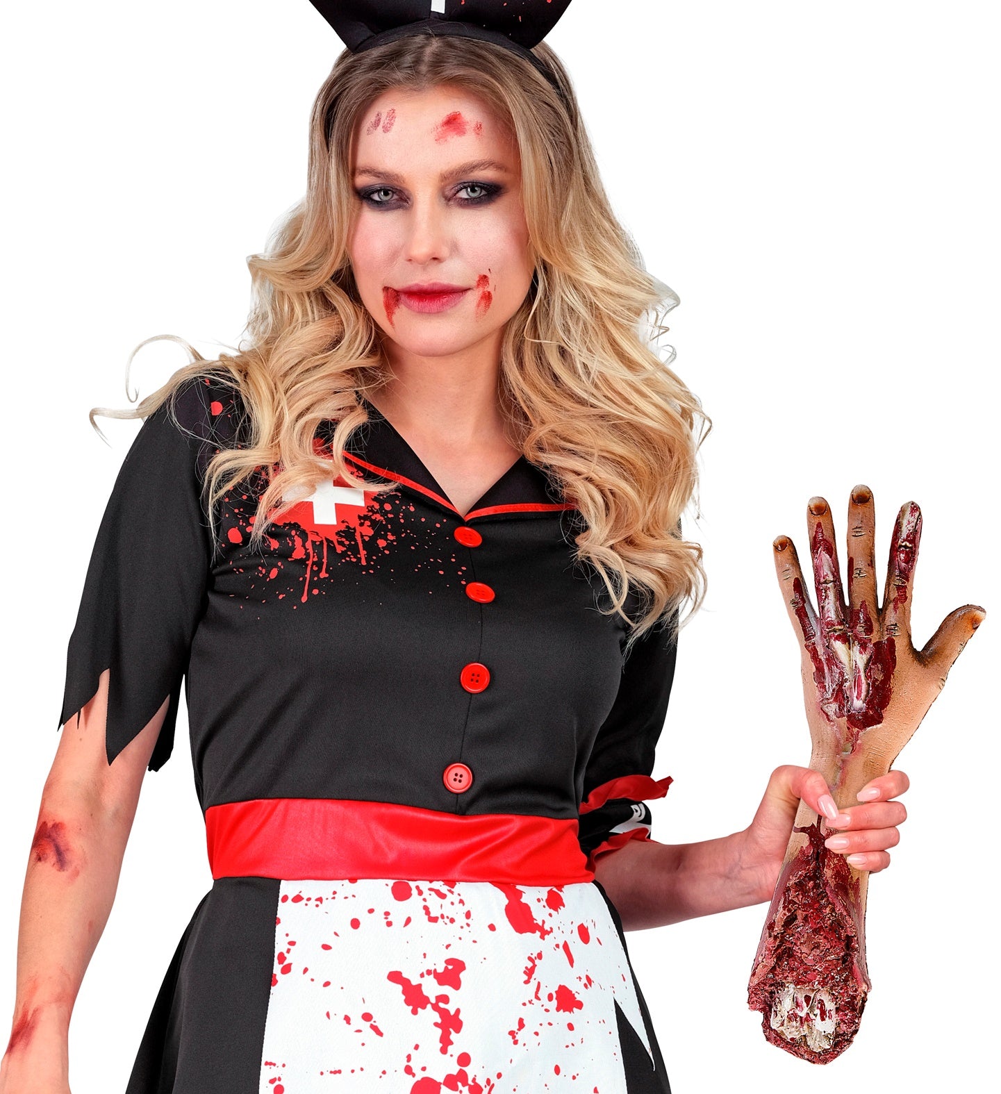 A woman in a bloody zombie nurse costume holding the gruesome fake severed arm prop.