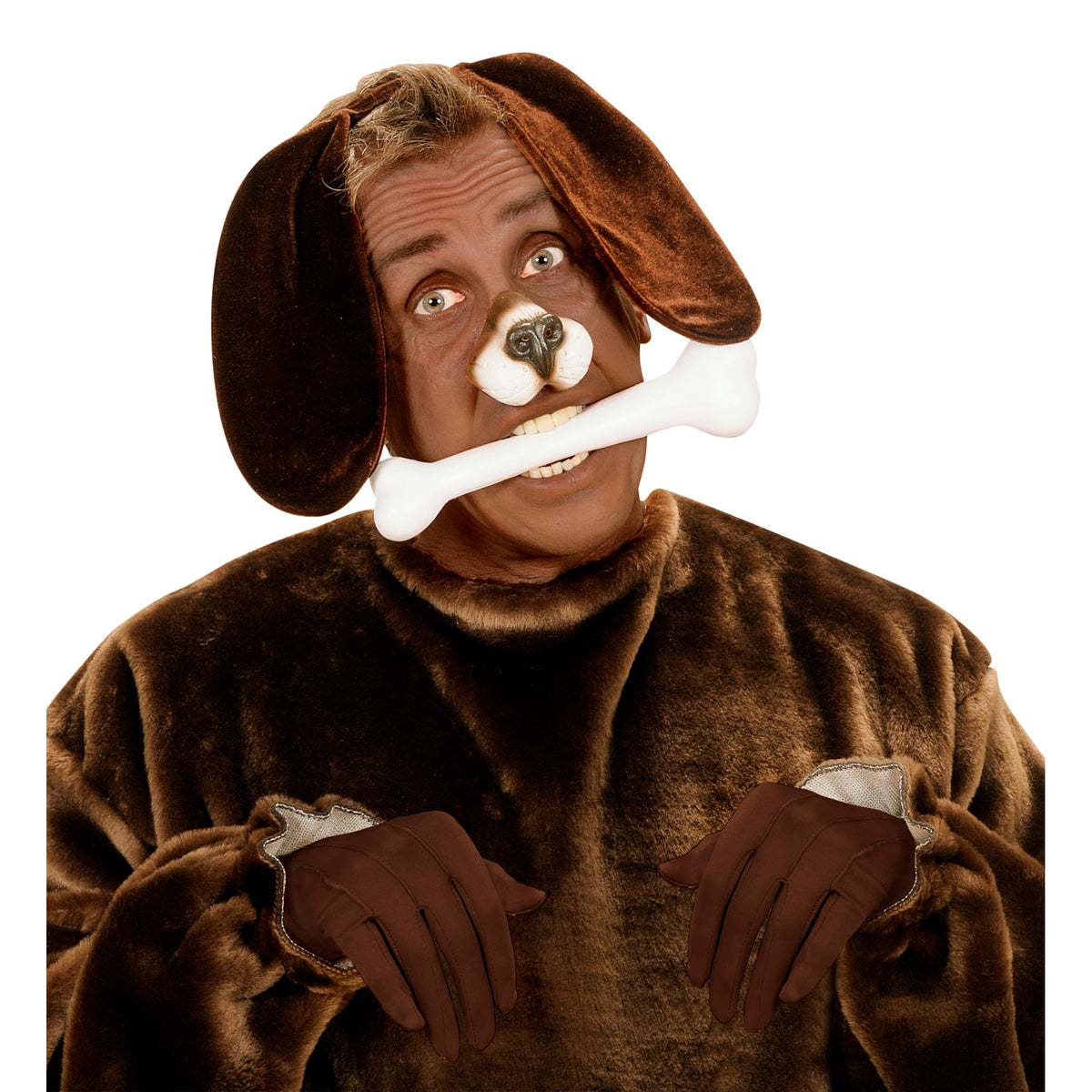 A person wearing a brown plush dog costume with floppy dog ears, brown gloves, and a white bone prop in their mouth, photographed against a plain white background.