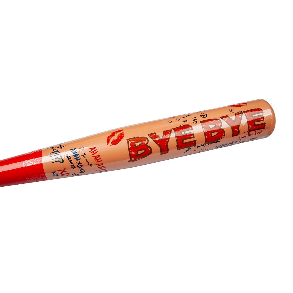 A close-up of a Harley Quinn style 'Bye Bye' baseball bat, showing the scribbled text and lipstick kiss mark details.