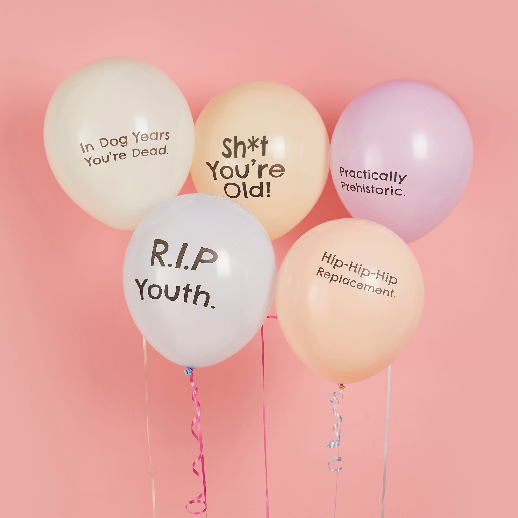 Pack of 5 cheeky birthday balloons in pastel colours with funny aging insults like Sh*t You're Old.