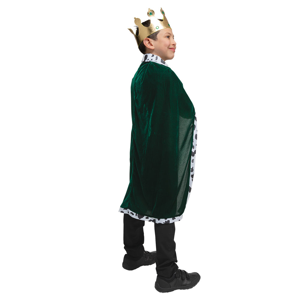 Side view of a child wearing the green velvet king's robe and crown.
