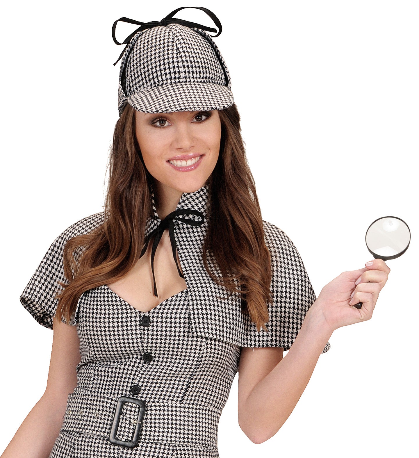 A person smiling playfully while wearing a black and white houndstooth detective deerstalker hat and matching collared outfit, holding up a small black magnifying glass.