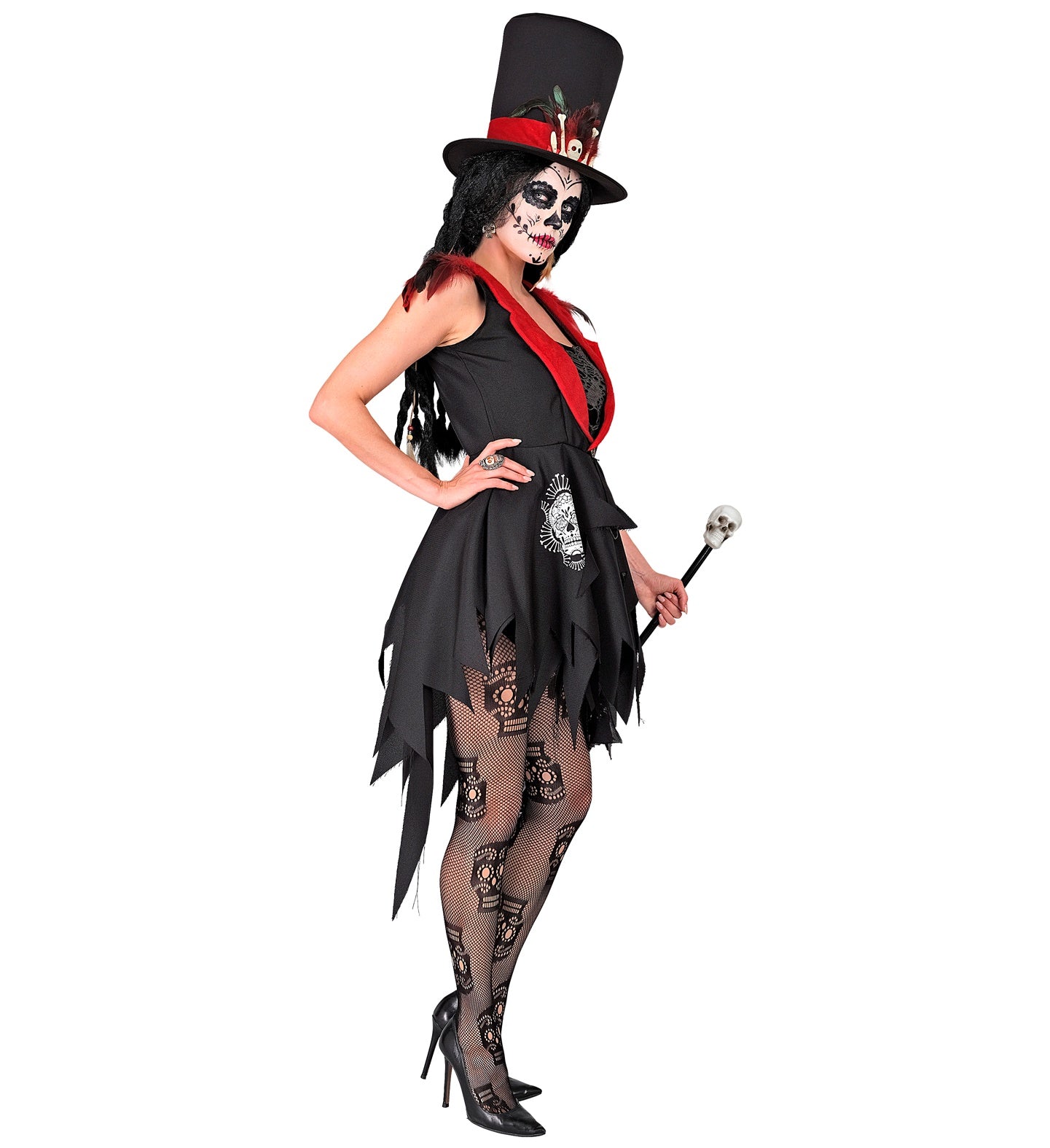 A side profile of a woman in a Voodoo-themed Dia De Los Muertos costume, with one hand on their hip and the other holding a cane. The costume includes a tattered black dress, a red lapel, a top hat, and skeleton-themed fishnet tights.