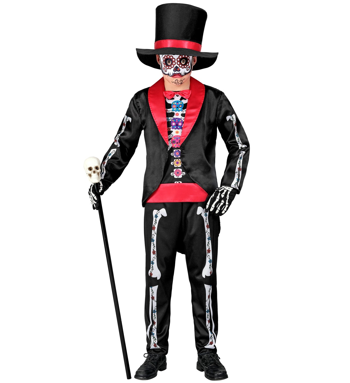 A child in a Dia De Los Muertos costume, holding a cane with a skull topper. The costume includes a black tailcoat with a red lapel, a colorful shirt with a vest, skeleton-themed pants, a top hat, and a mask with sugar skull face paint.