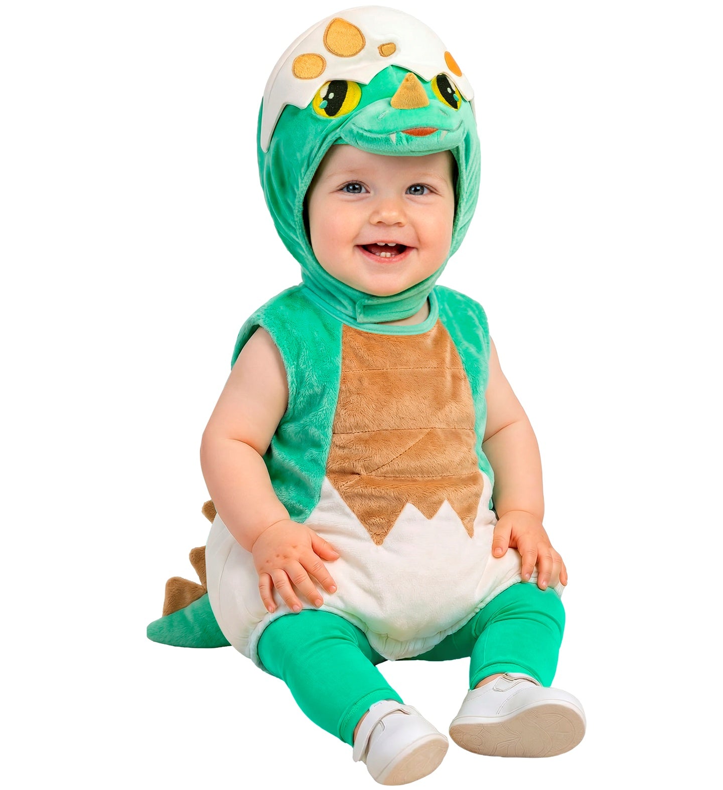A happy baby sitting down wearing a green dinosaur fancy dress tunic designed like a cracked eggshell, complete with matching green leggings and a soft character hood.