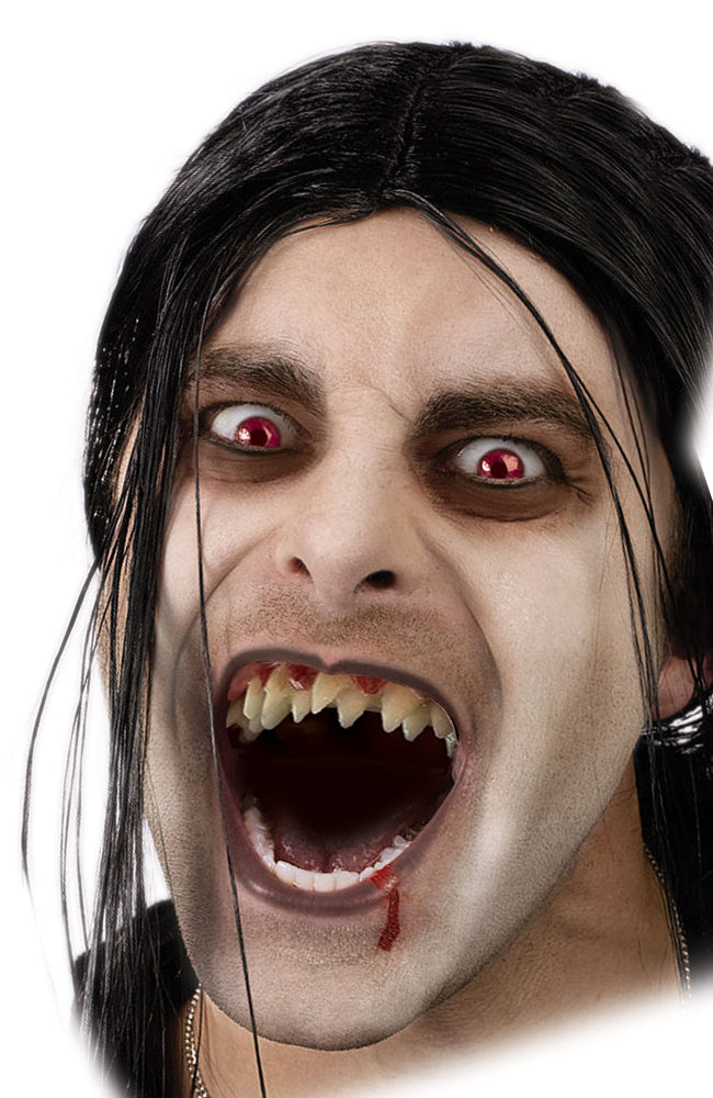 A person in a vampire costume with red eyes and a black wig, showing off a set of sharp, jagged, double-fanged monster teeth.