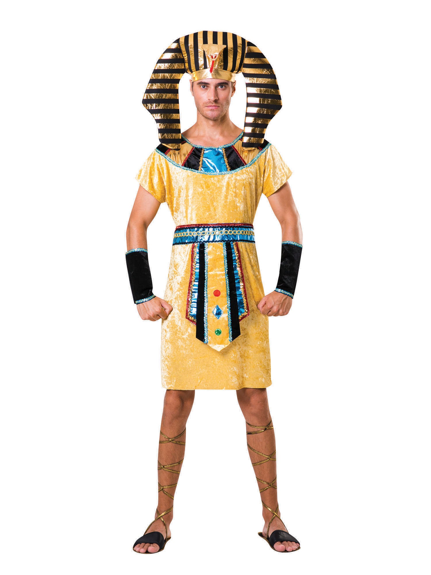 Man wearing an Egyptian Pharaoh Costume, featuring a golden robe with blue and black accents, a large striped gold and black pharaoh headpiece, black arm bands, and brown lace-up sandals.