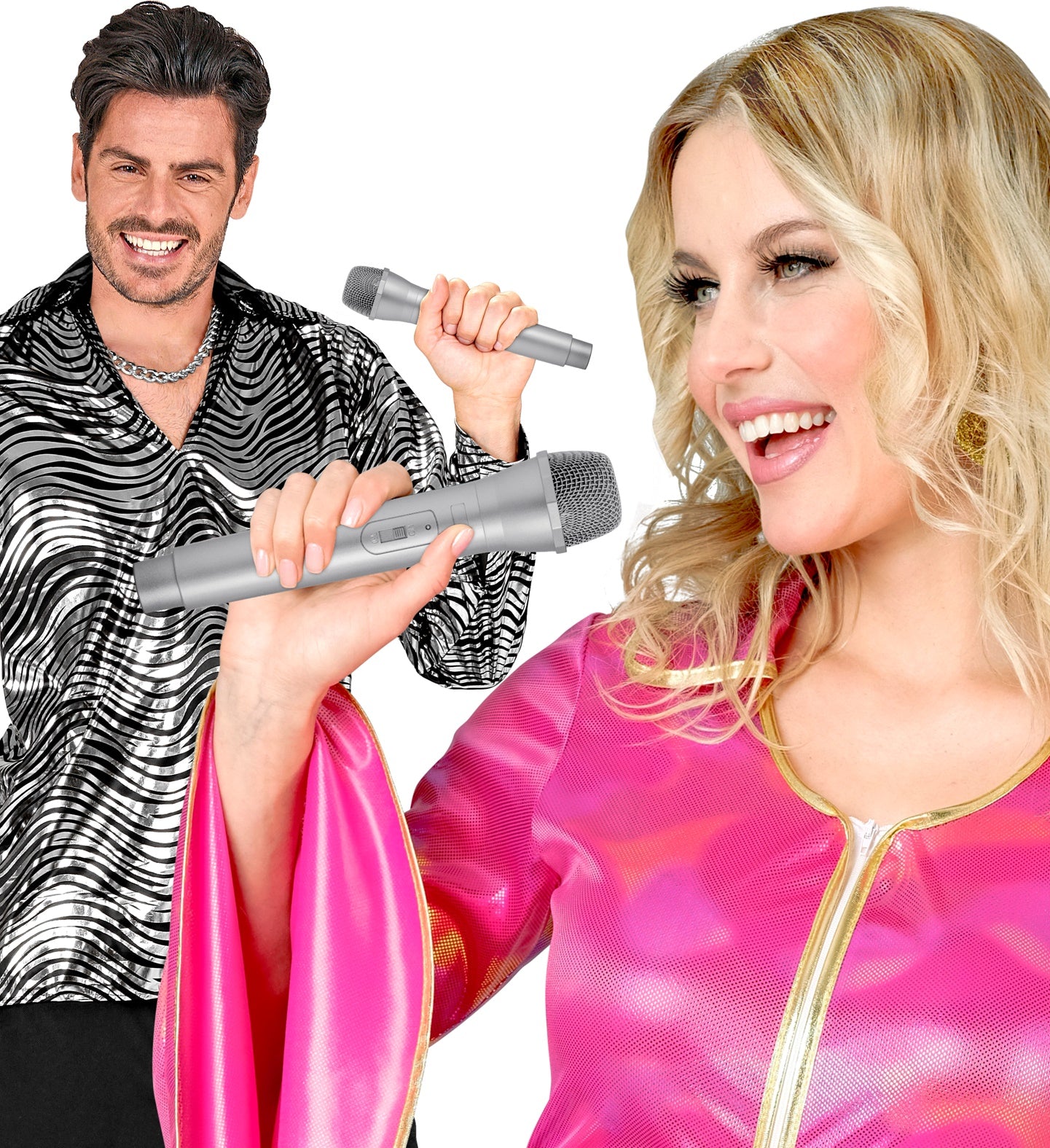Man in a disco shirt and woman in a pink pop star outfit singing into silver fake microphone props.