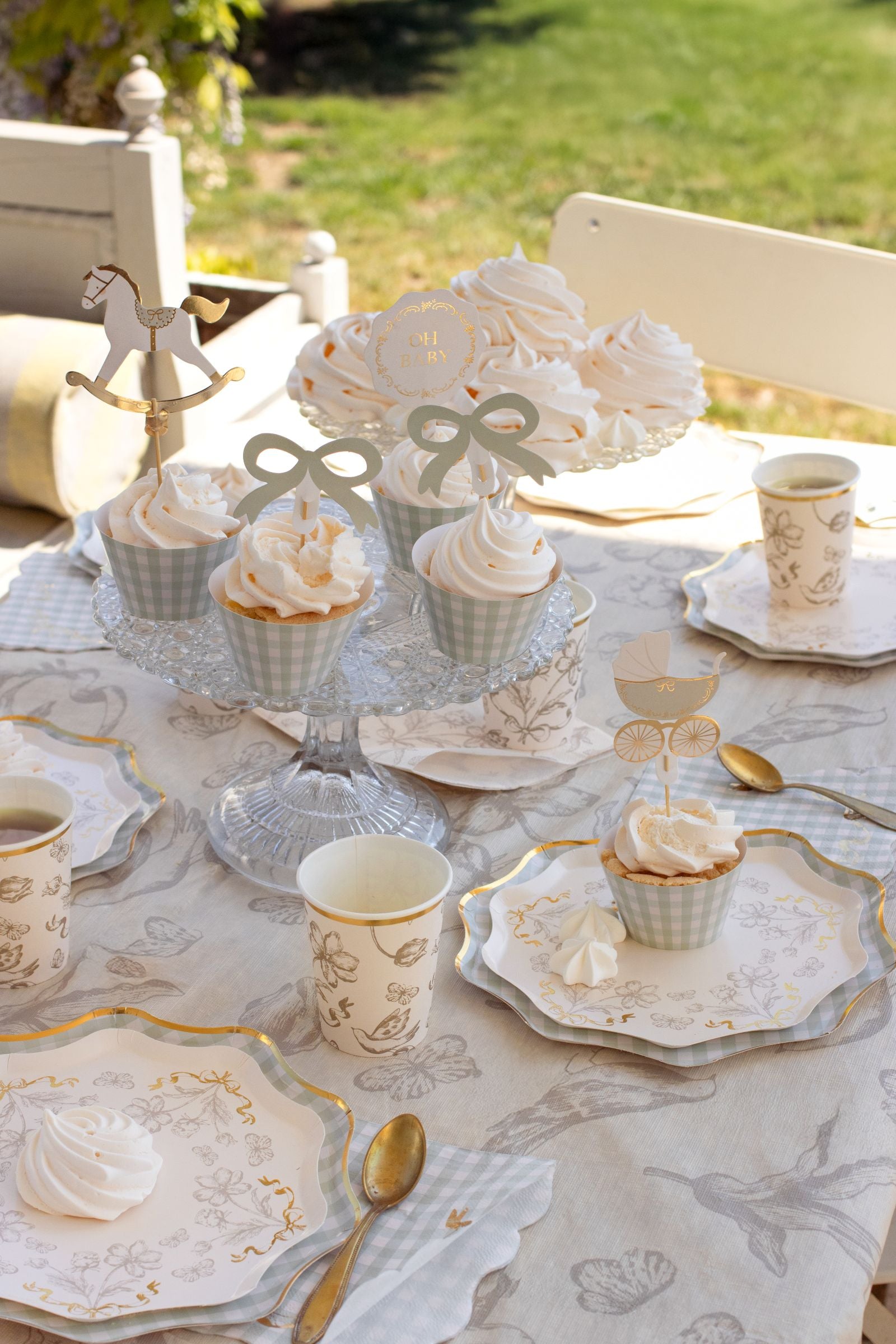 Close-up of a Flower Paper Plate served with a gourmet cupcake at a garden party.
