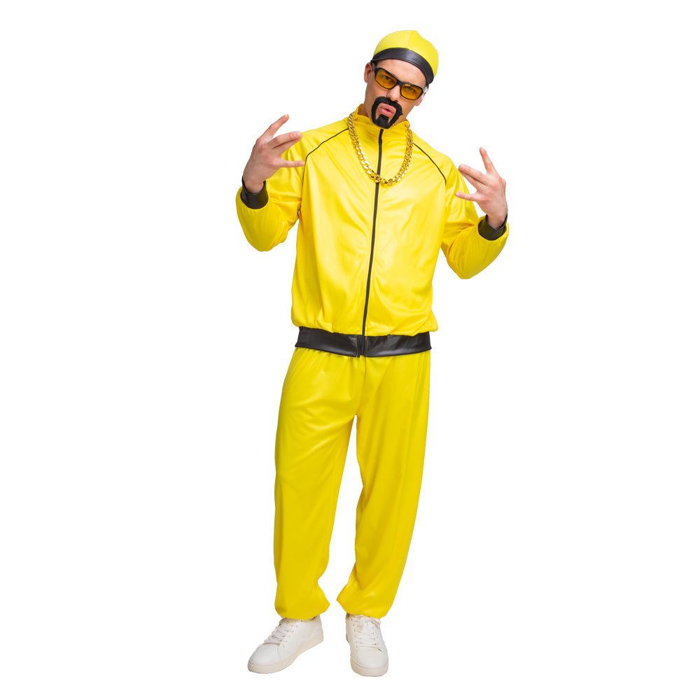 Adult wearing bright yellow Ali G rapper costume with shiny jacket, matching trousers, yellow and black cap, yellow-tinted sunglasses, stick-on goatee beard and gold plastic chain, posing with arms outstretched