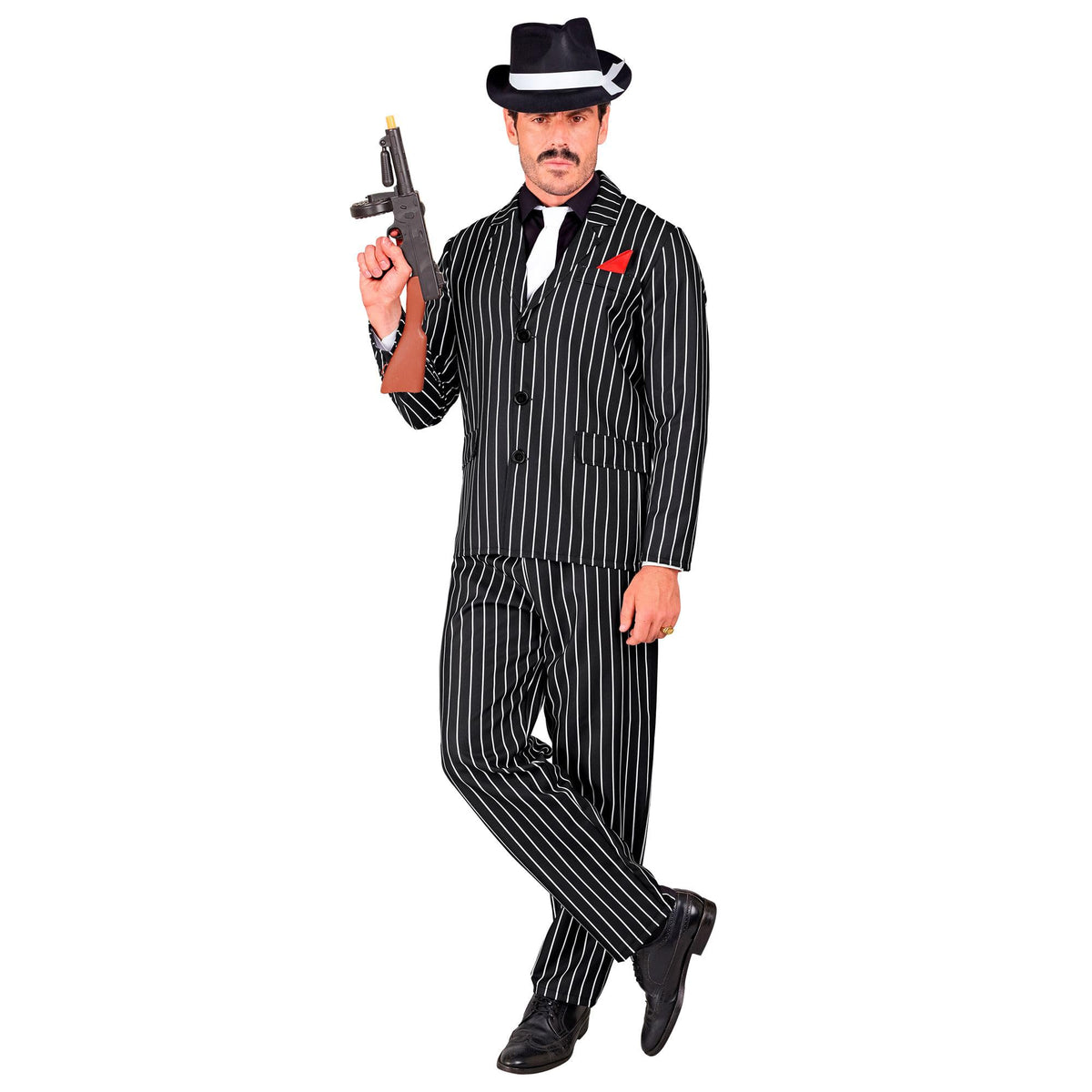 A man modeling a 1920s gangster costume featuring a black and white pinstripe suit jacket with a red pocket square, matching pants, and a white tie, holding a prop Tommy gun.