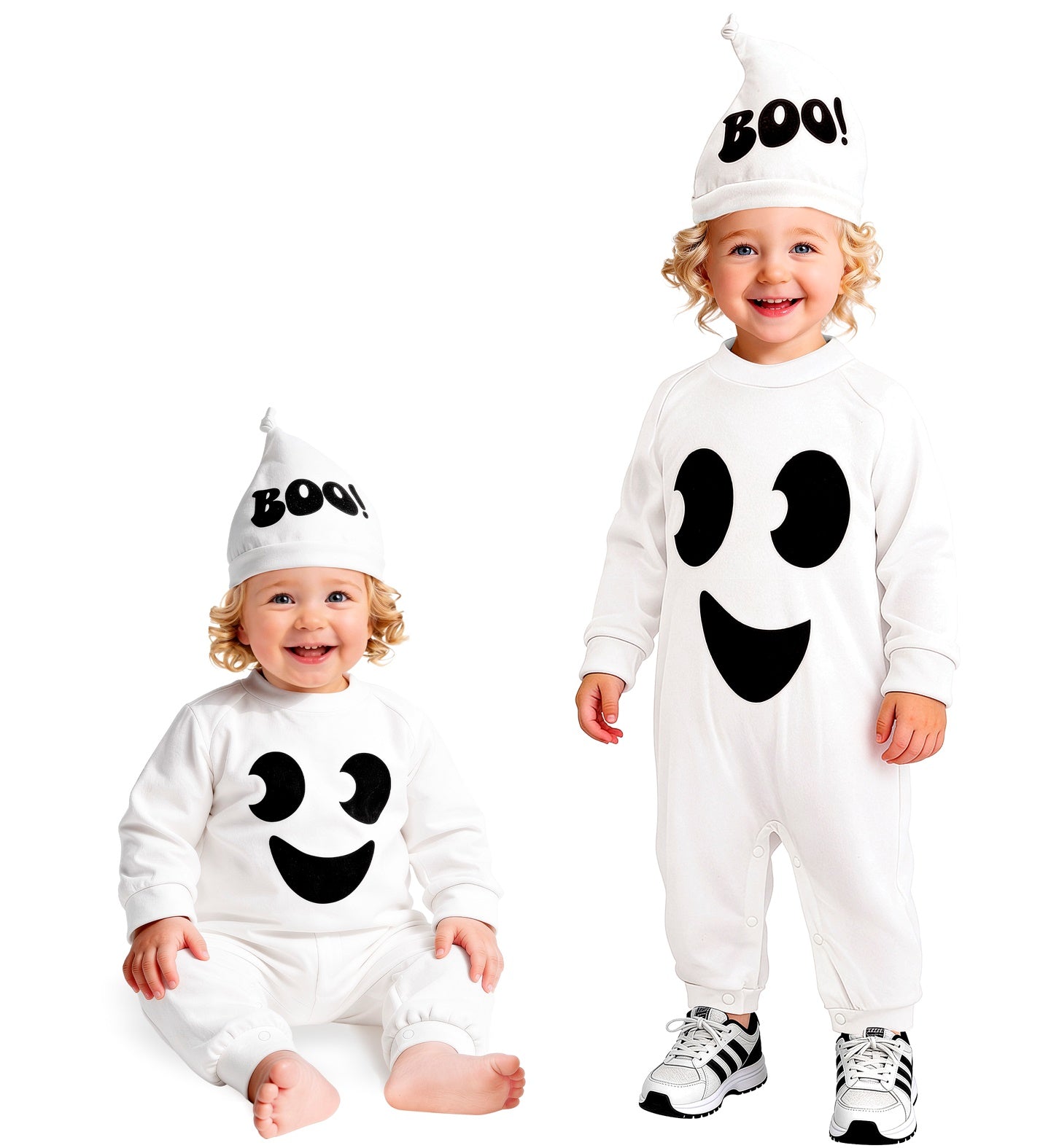 Two smiling children posing together in matching white baby and toddler ghost costumes; one child is sitting comfortably on the floor and the other is standing next to them.
