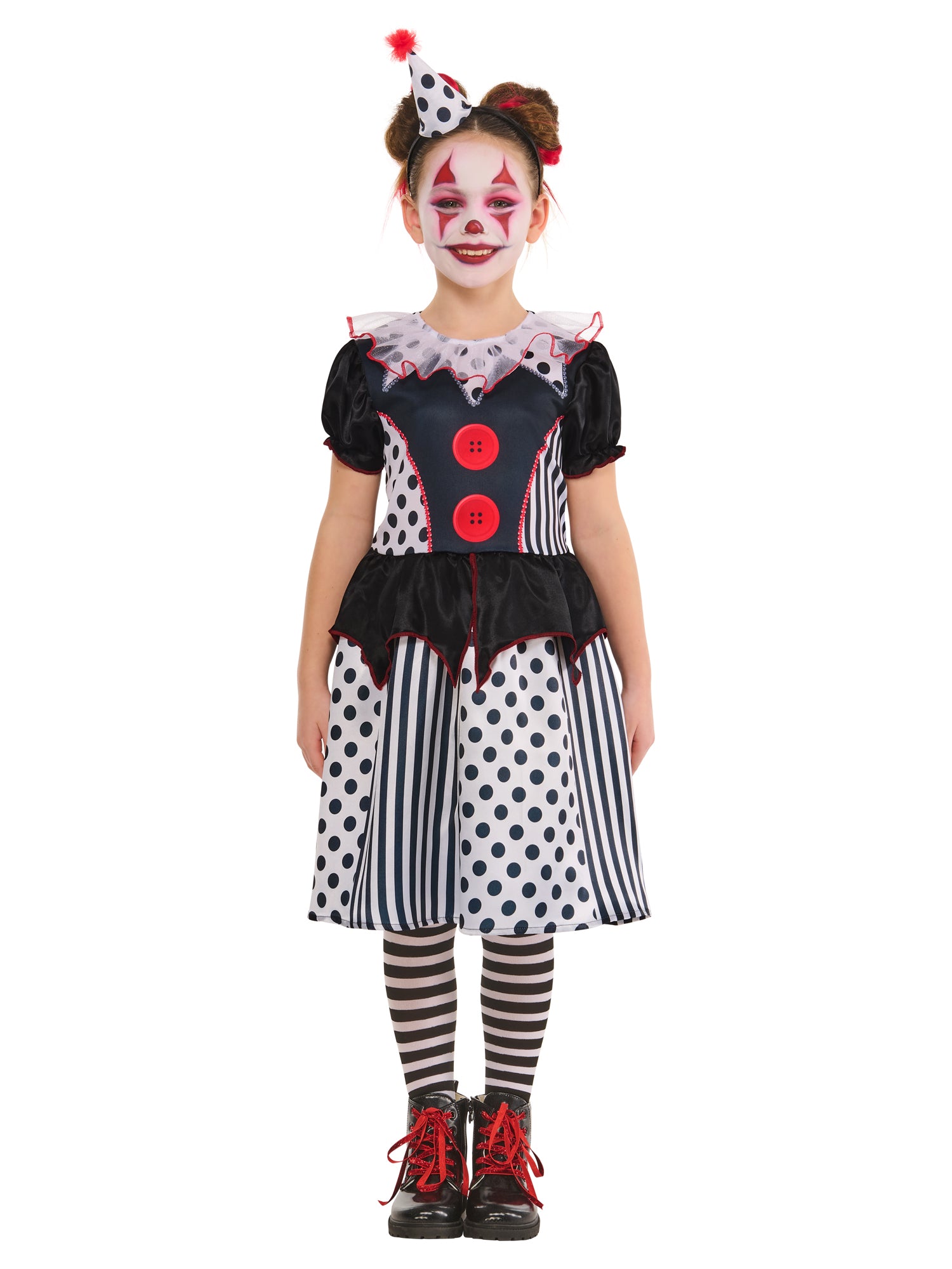Child wearing a clown costume with polka dot dress and striped tights on a white background