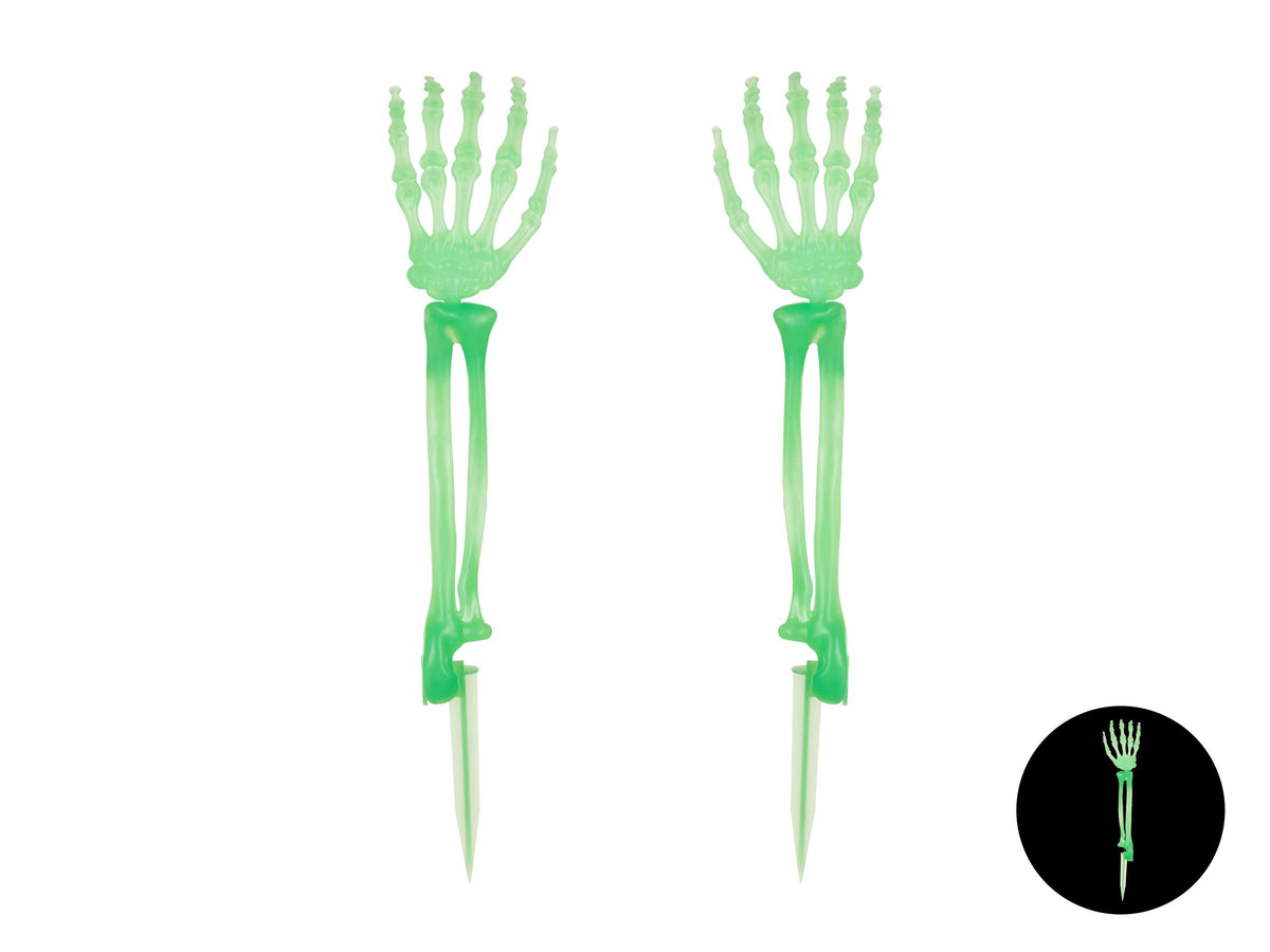 Pair of glow-in-the-dark skeleton hands with spike bases, plus inset showing the glow effect in darkness