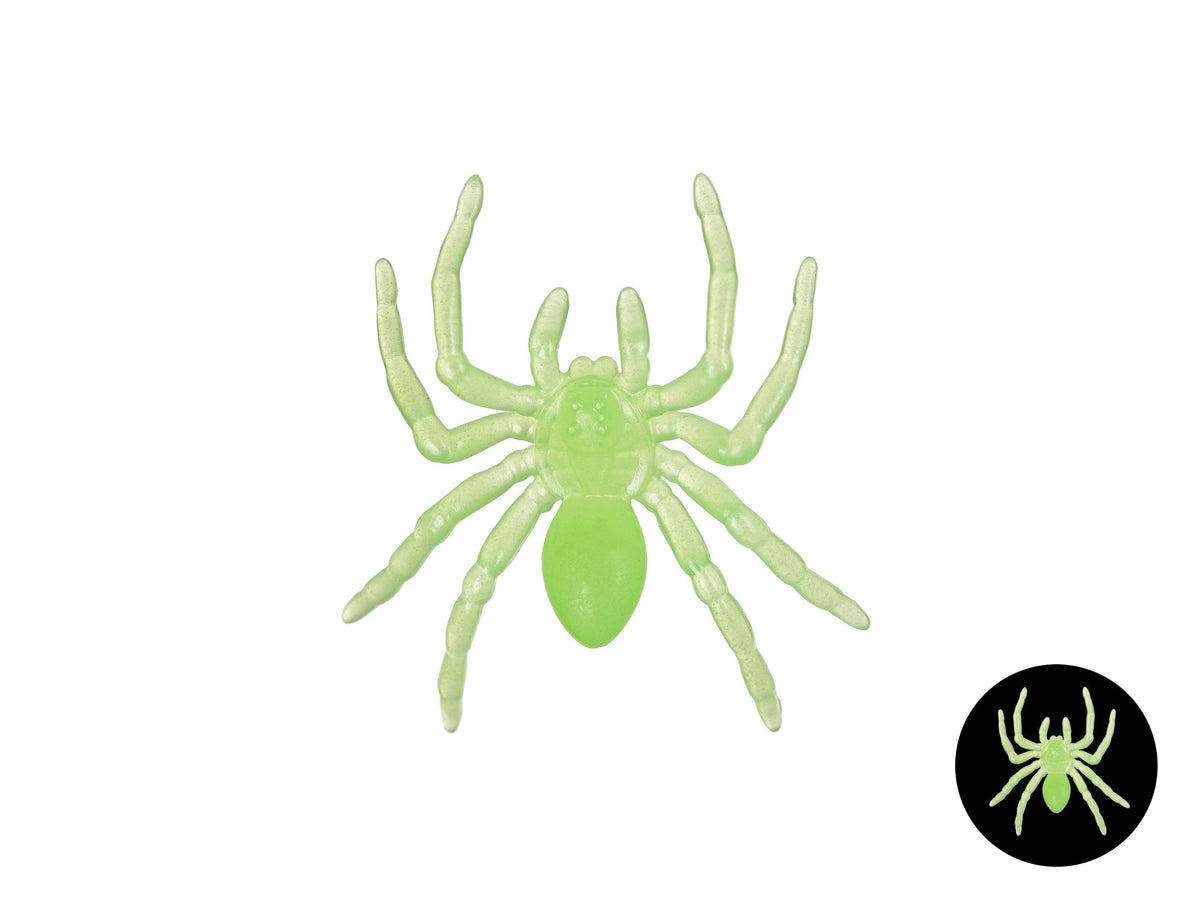 A translucent light green spider decoration or toy shown on a plain white background, with a small circular inset in the lower right showing the same spider design on a black background.