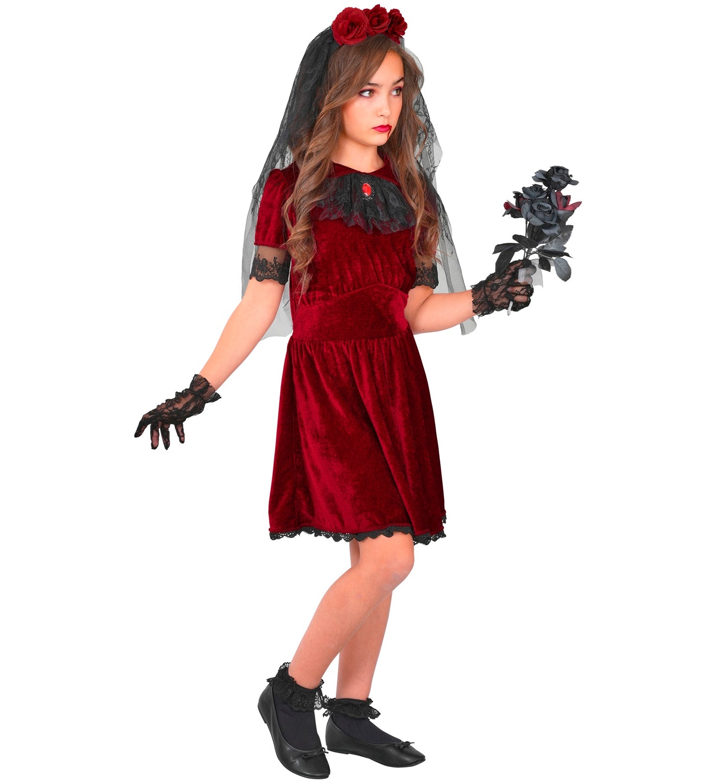 A side-profile view of a child wearing a kids' vampire bride costume, highlighting the flowing black mesh layers of the veil and skirt, the velvet-textured bodice, and a playful hand gesture.