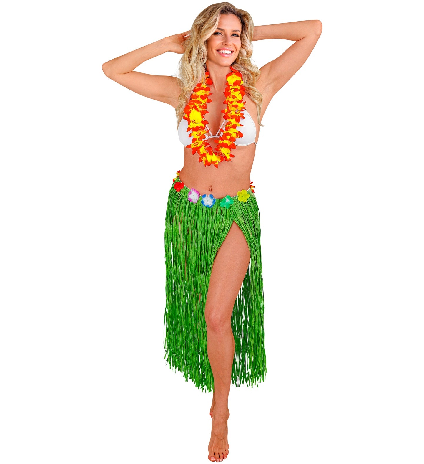 A smiling woman wearing a white bikini top, a red and yellow lei, and a long, green Hawaiian hula skirt with a colorful flower waist, with hands behind her head, against a white background.