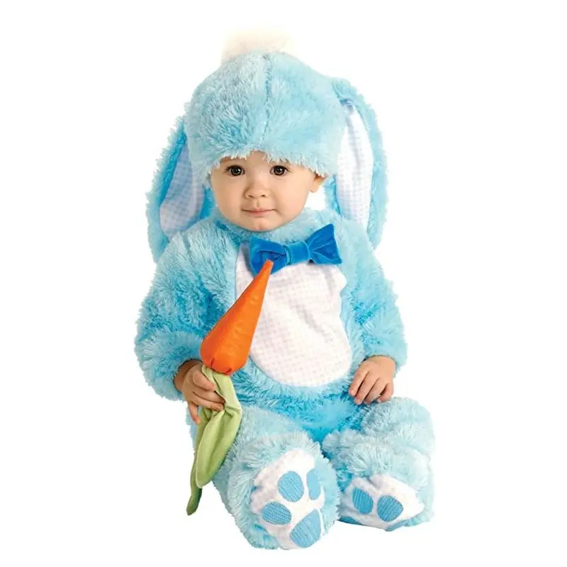 Baby wearing a light blue faux fur Handsome Lil' Wabbit costume, which includes a jumpsuit with white belly and paw prints, a hat with long floppy ears, and holding an orange carrot rattle.
