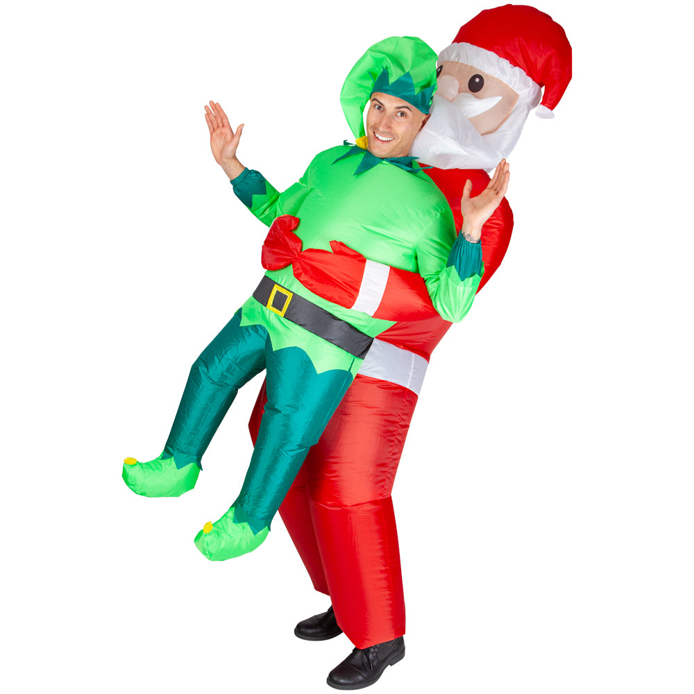 A person in the inflatable carry me elf costume, waving their hands in a playful pose.