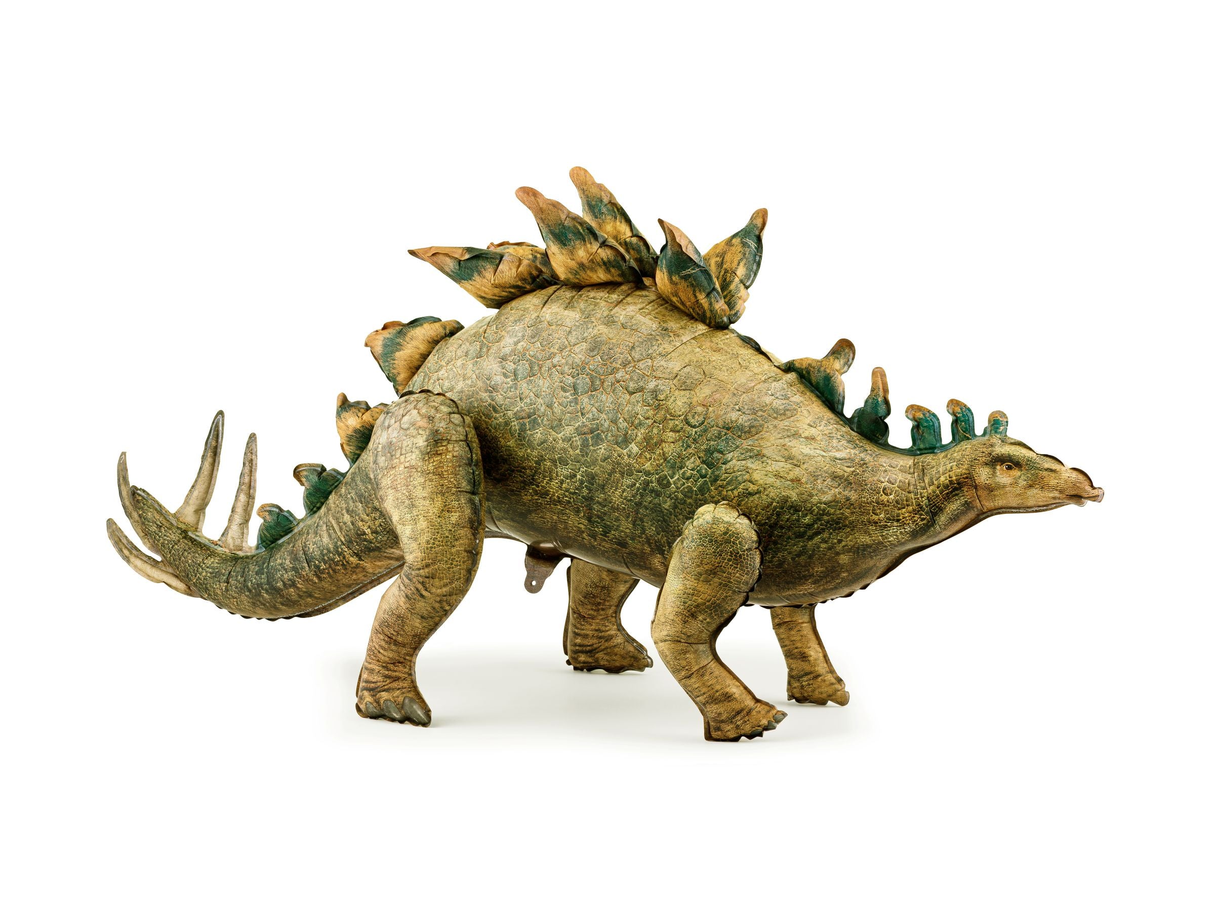 Side profile of a standing Stegosaurus foil balloon in realistic green and brown tones with back plates and spiked tail.