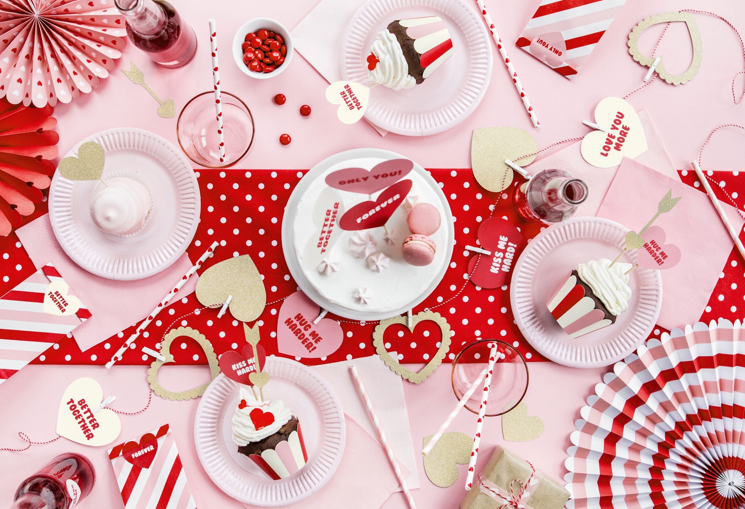 A close-up of a refreshing drink with a light pink striped paper straw at a garden party.