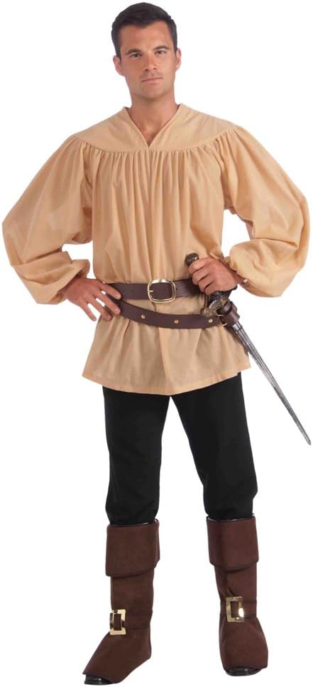 A man posing confidently in a light tan, loose-fitting medieval fancy dress shirt featuring a V-neckline, gathered shoulders, and long billowing sleeves with cinched wrists. He is styled with dark trousers, brown boot covers, and a double brown belt holding a prop sword.