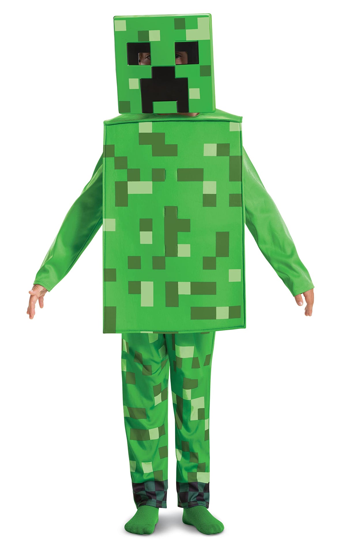 Full front view of child in Minecraft Creeper costume showing the complete pixelated green jumpsuit with darker patches, foam overlay body piece and detachable creeper mask with characteristic angry face