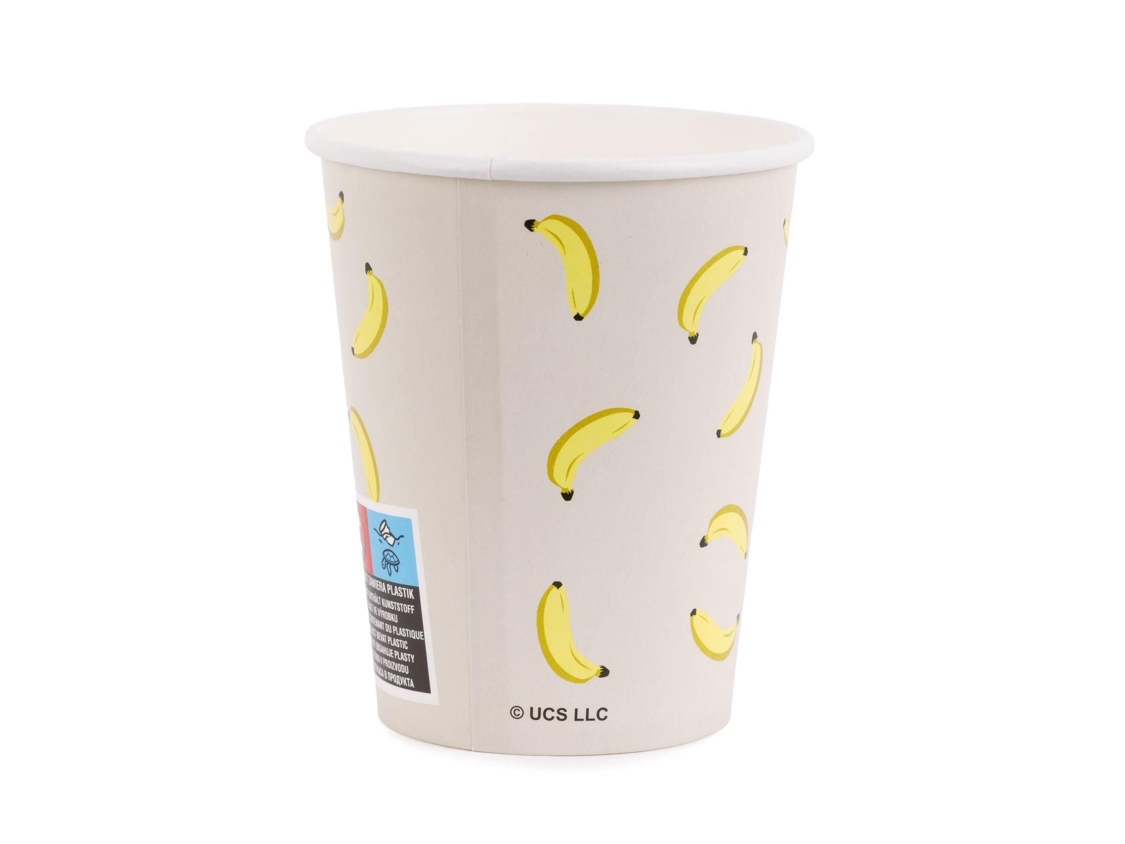 The back of a beige Minions party paper cup featuring a scattered yellow banana pattern.