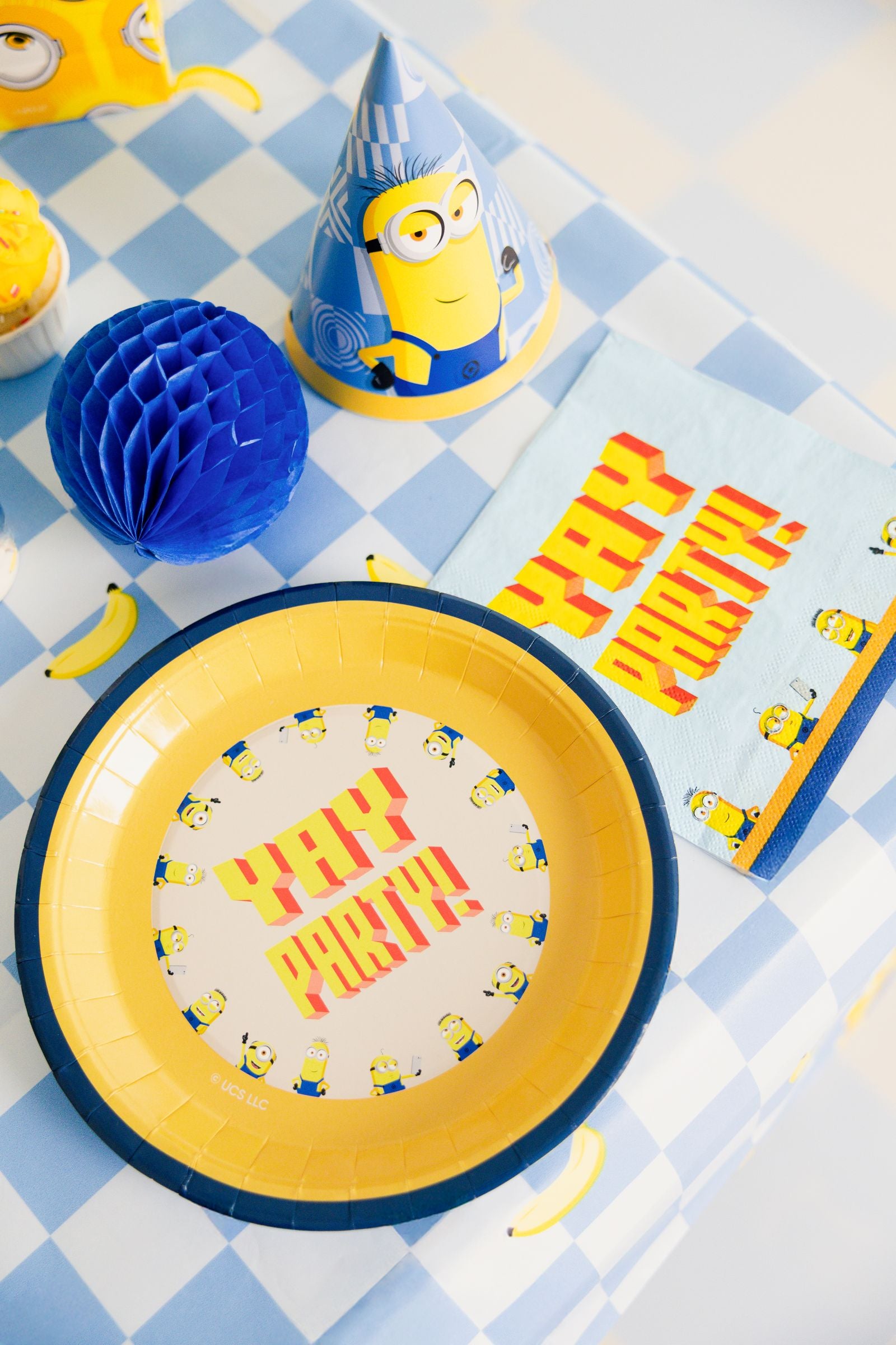 A packaged set of 6 Minions themed round disposable party plates featuring a colourful "YAY PARTY!" graphic.