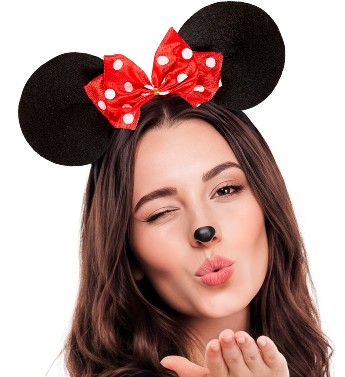A woman wearing a Minnie Mouse-inspired costume headband with black mouse ears and a red bow with white polka dots, posing against a white background.