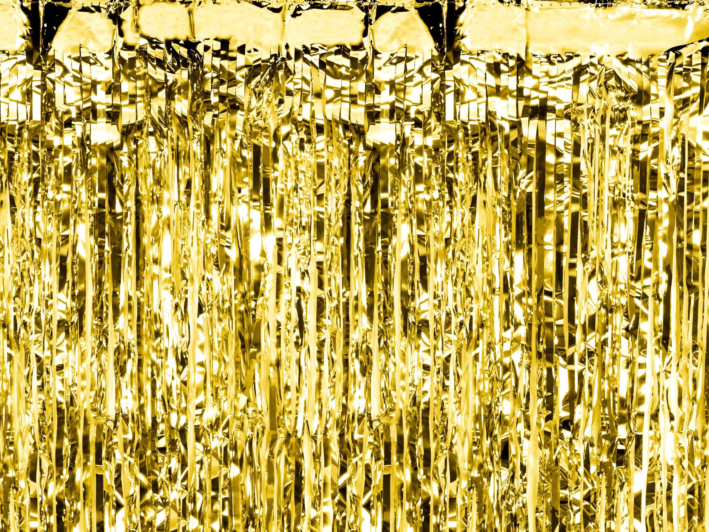 Close-up of a metallic gold foil party curtain showing shimmering fringe details.