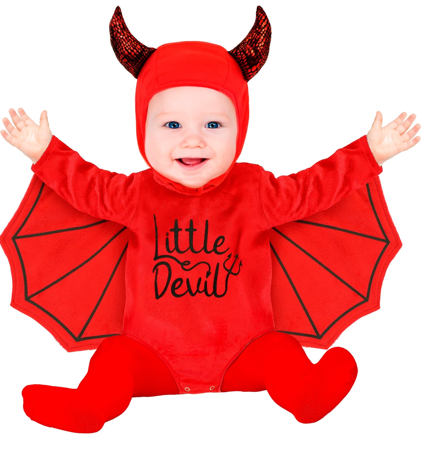 A child wearing a red plush jumpsuit with attached devil wings and a matching hooded headpiece with red horns, smiling and sitting against a white background.