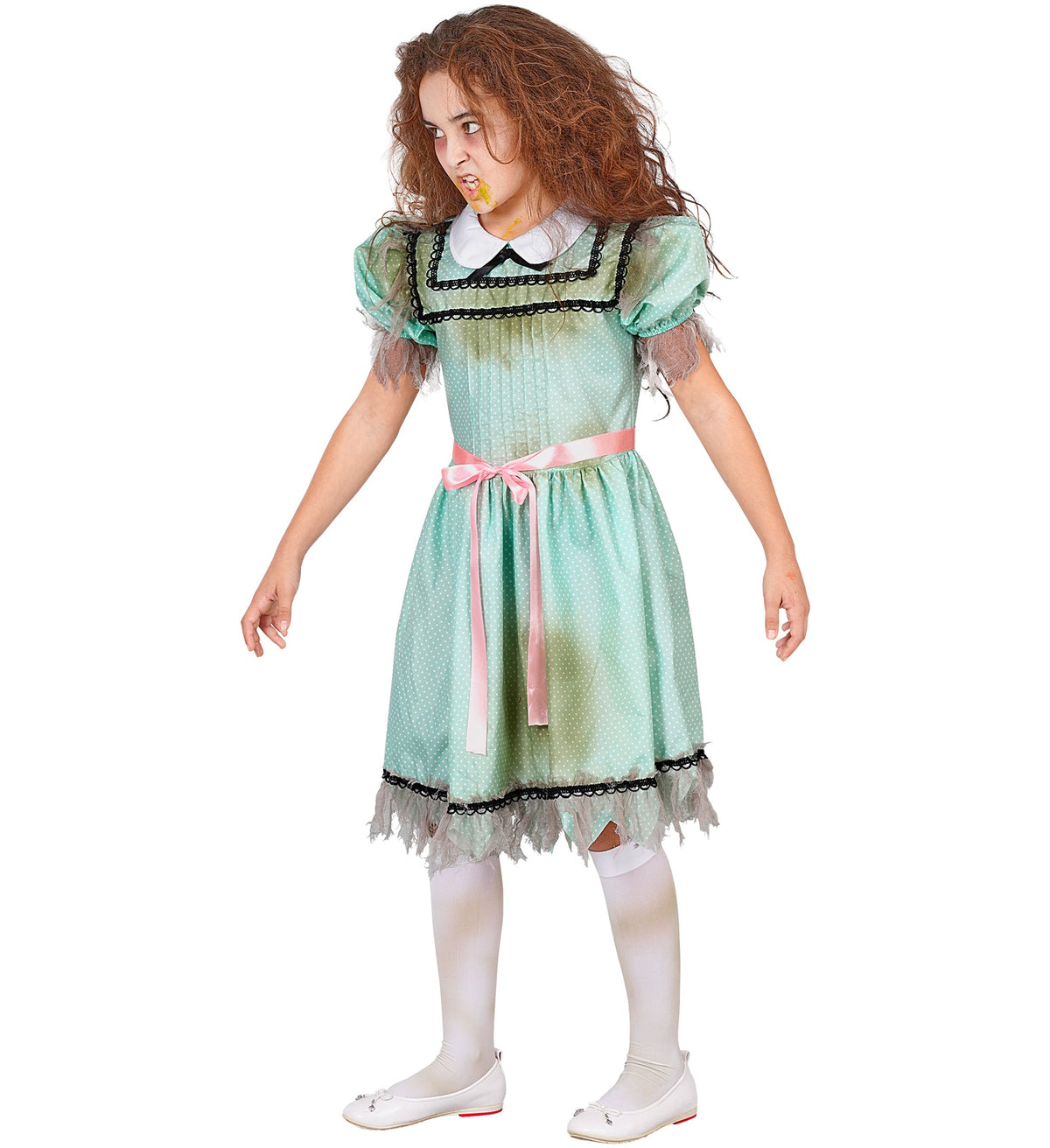 A child dressed as a possessed girl, looking to the side with messy hair, pale makeup, and a distressed green polka dot dress.