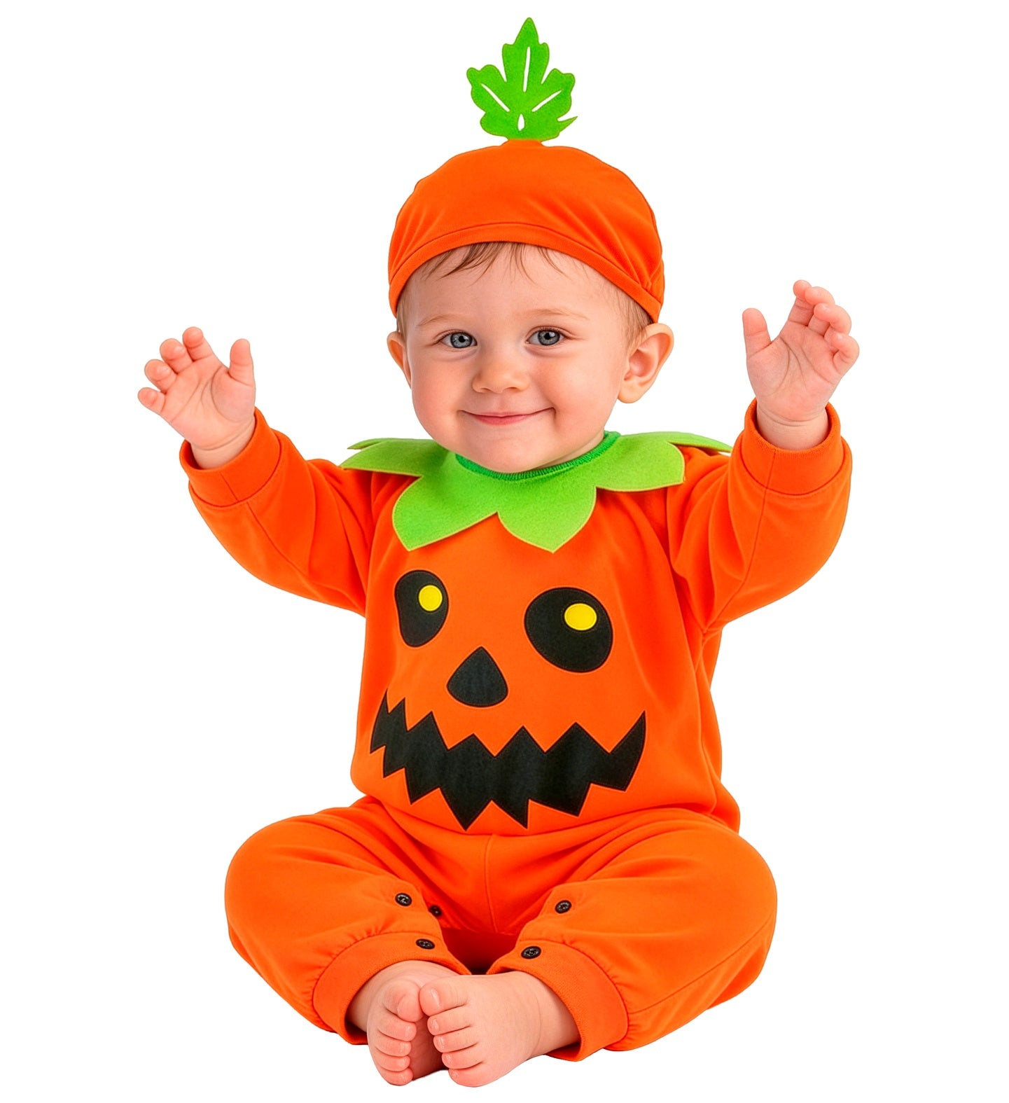 A happy child sitting on the floor with arms raised playfully, wearing a cozy orange pumpkin costume featuring a printed smiling face, a jagged green collar, and a matching stem hat.
