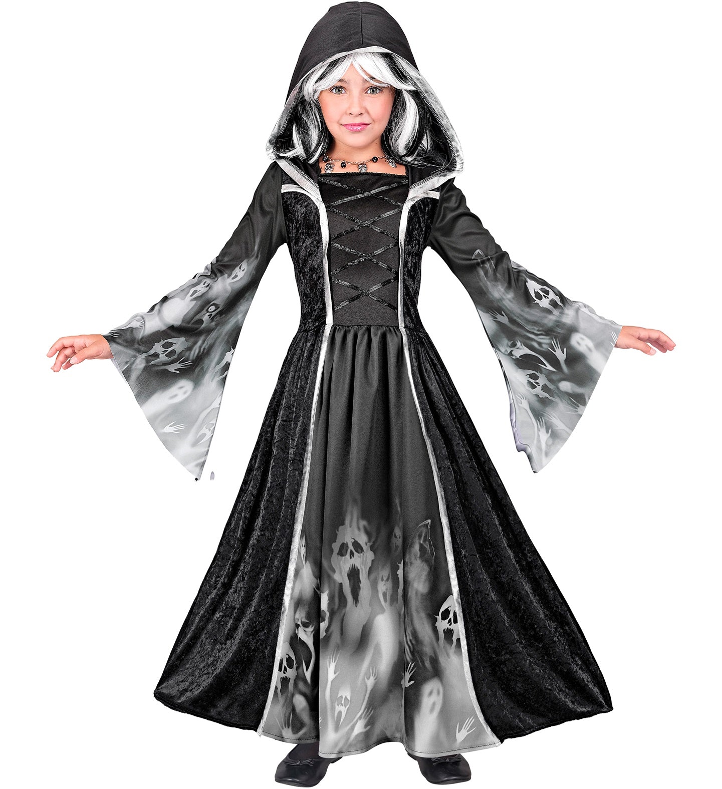 A child wearing a full-length, hooded black dress with a ghostly screaming faces print on the skirt and sleeves, posing with arms outstretched.