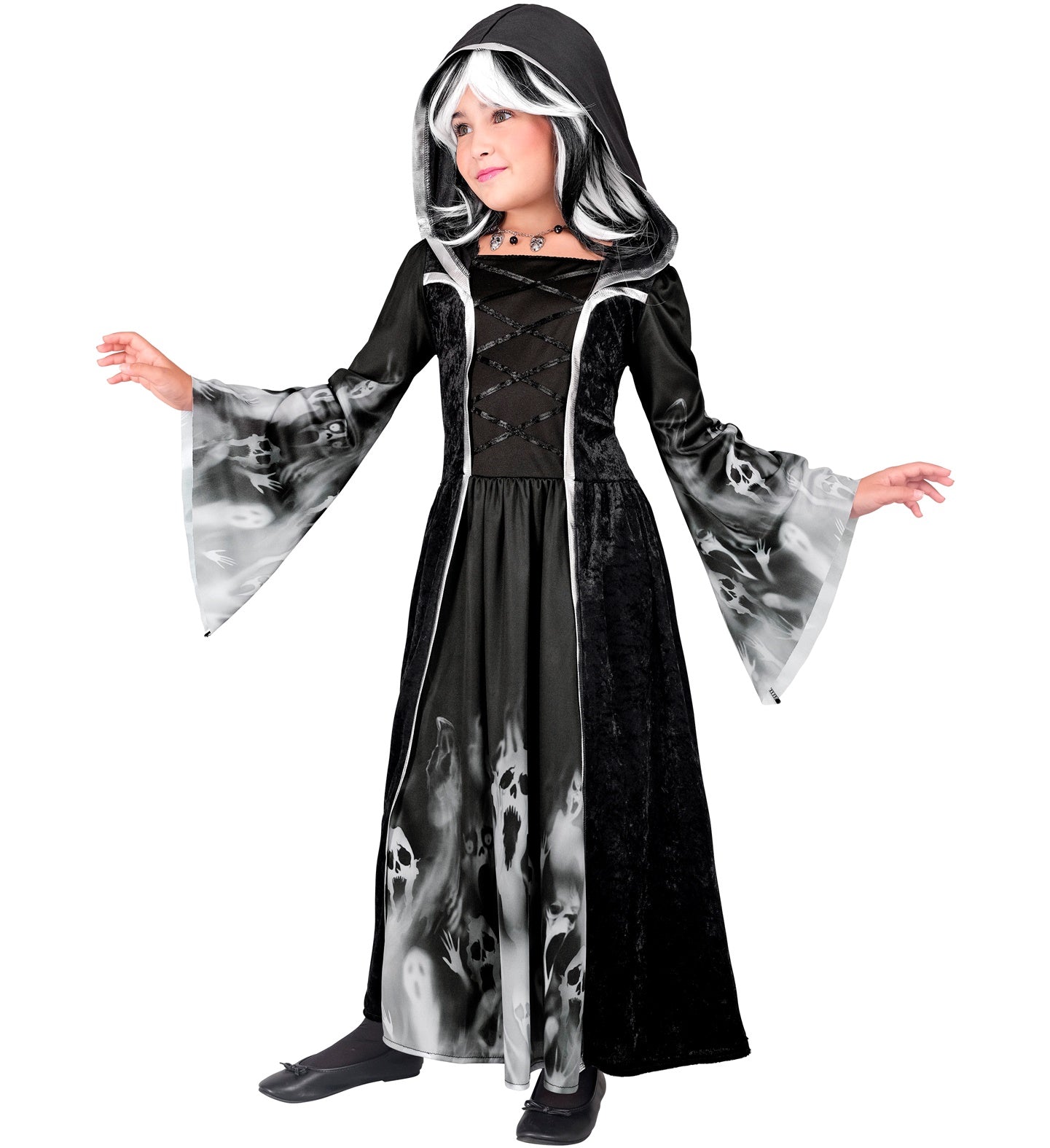 A child wearing a full-length, hooded black dress with a ghostly screaming faces print on the skirt and sleeves, posing with arms outstretched.