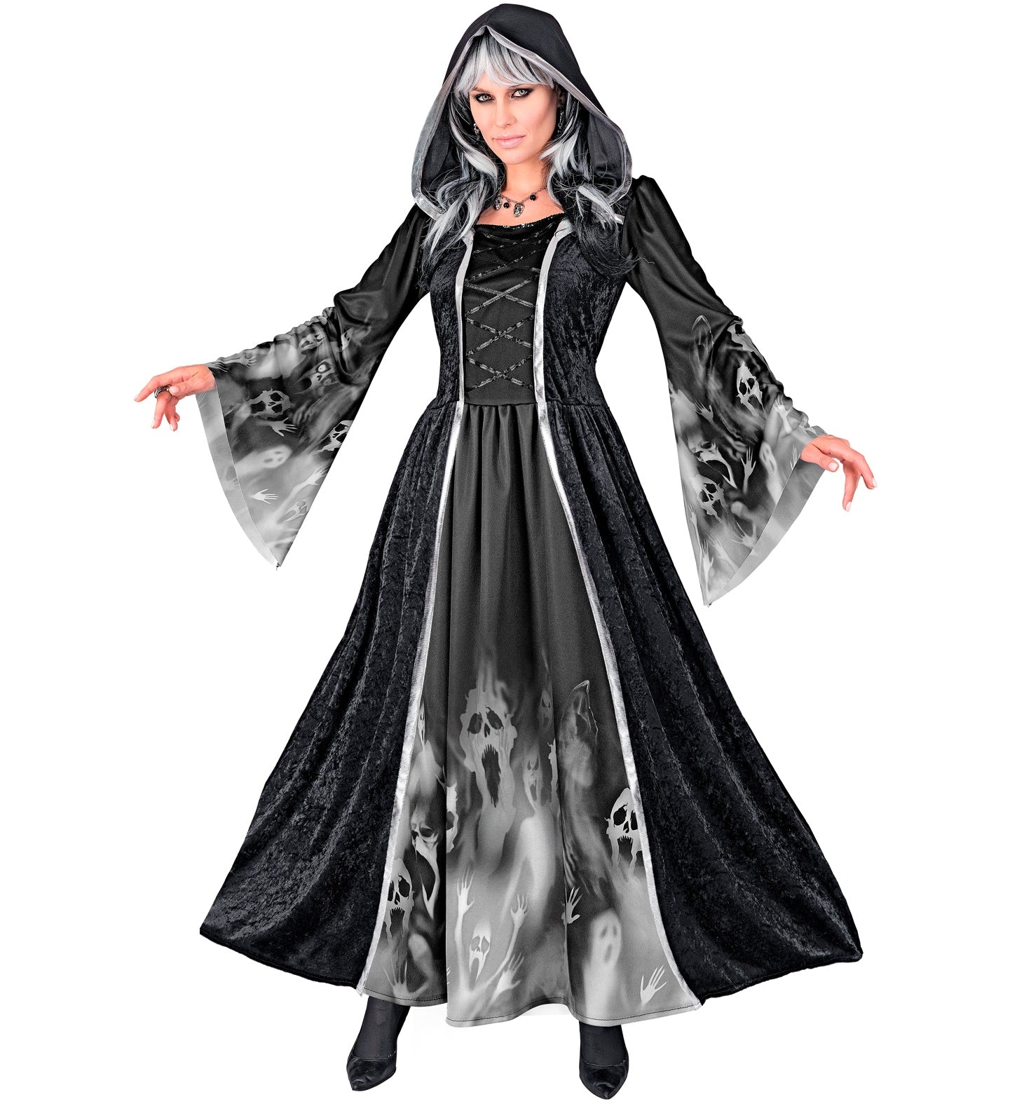 A person wearing a full-length, hooded black Gothic style dress with a ghostly screaming faces print on the skirt and sleeves, posing with arms outstretched.