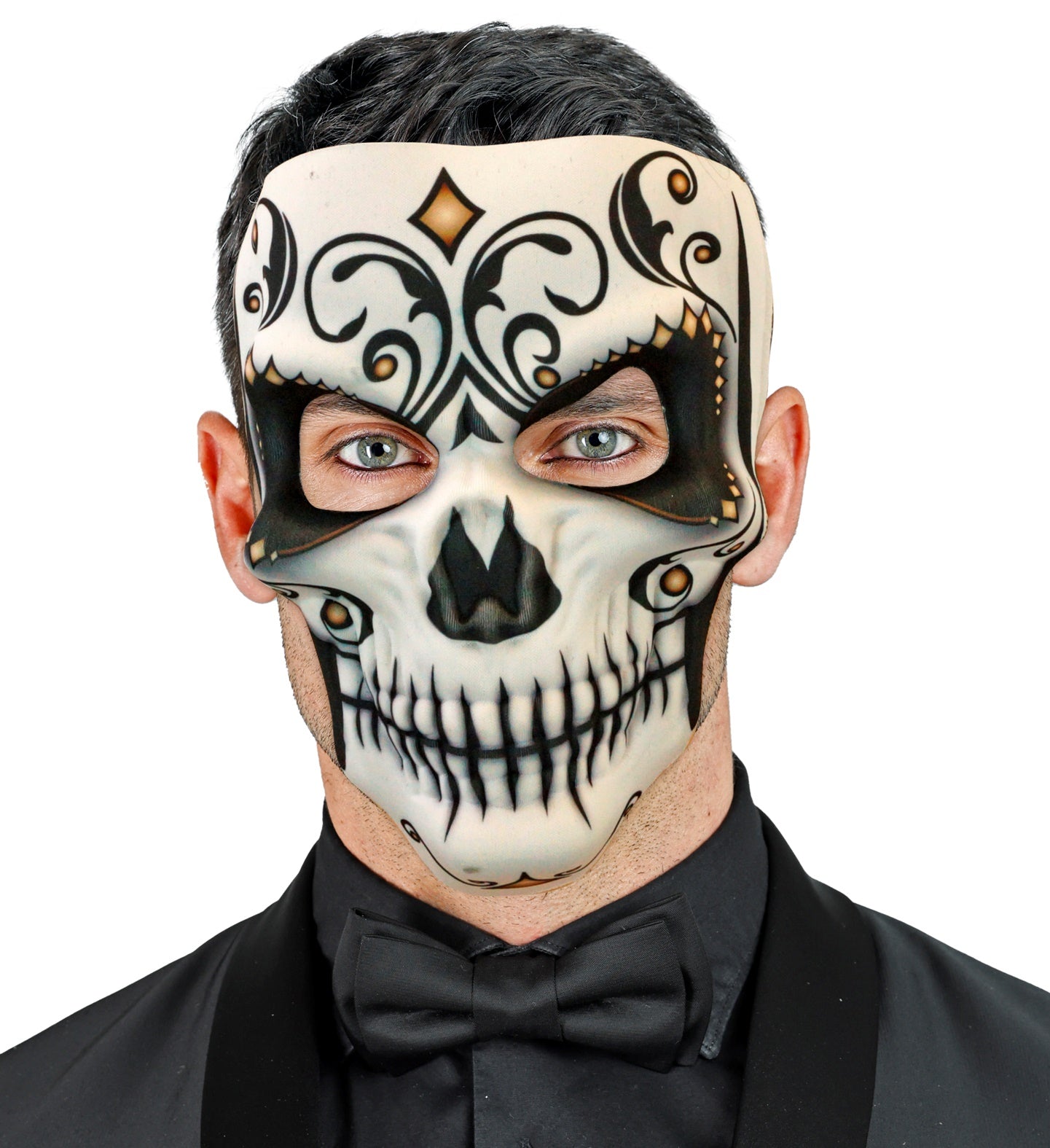 A man with blue eyes wearing a Señor Dia De Los Muertos sugar skull mask, paired with a black shirt and bow tie.