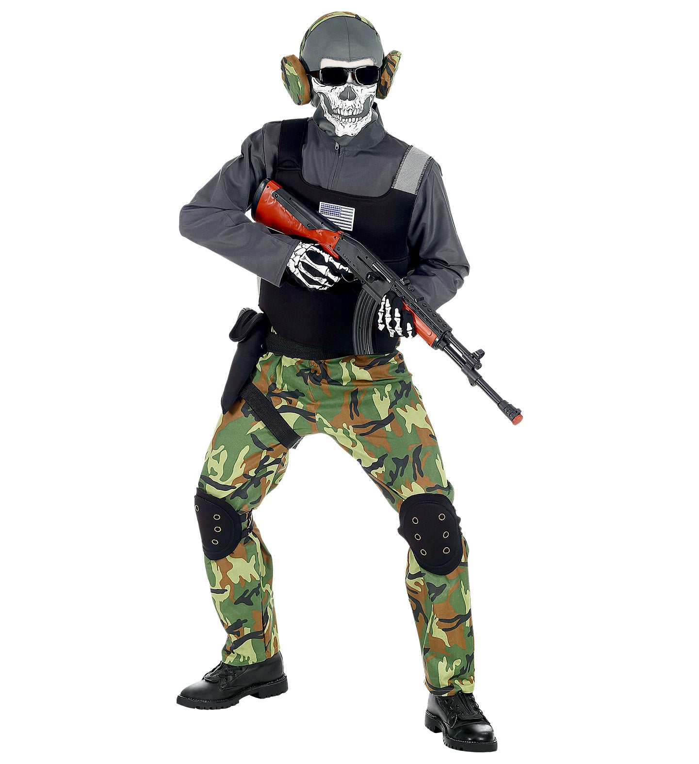 A child dressed in a skeleton soldier costume with camo trousers, a black tactical vest, and a skull mask, holding a toy rifle.
