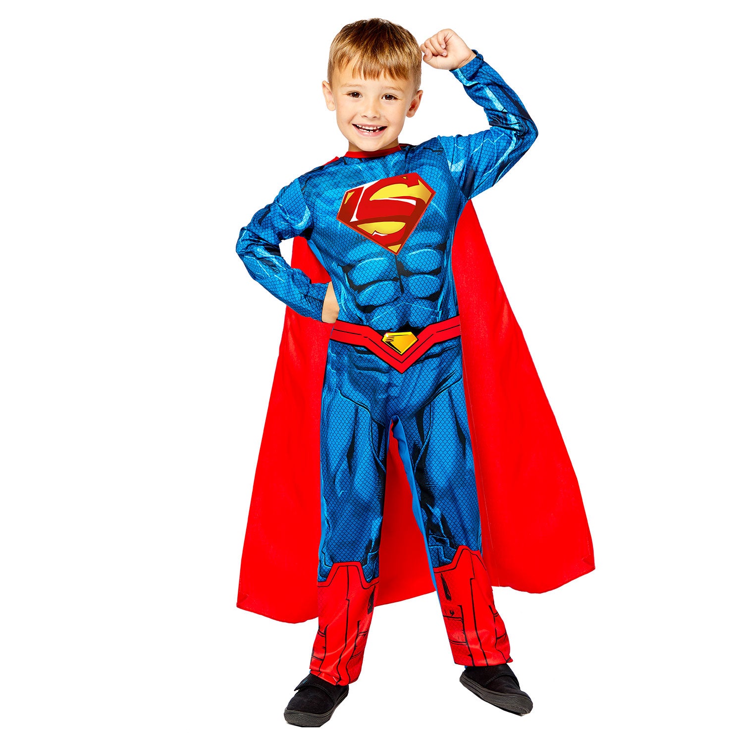 A smiling child flexing in an official Superman costume, which includes a printed muscle-suit jumpsuit and a long red cape.