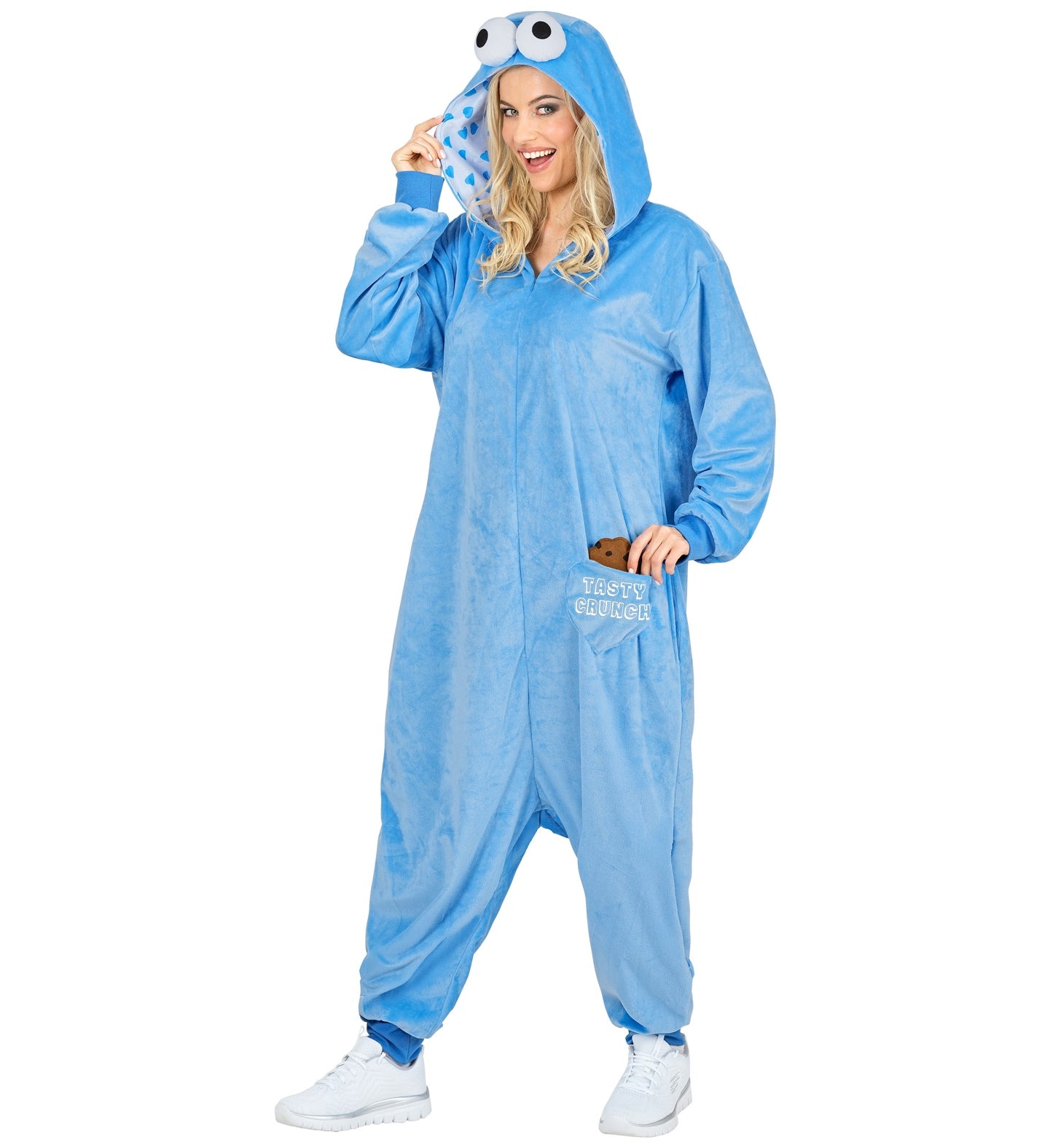 A woman modeling the soft blue plush monster onesie with googly-eye hoods and cookie pockets.