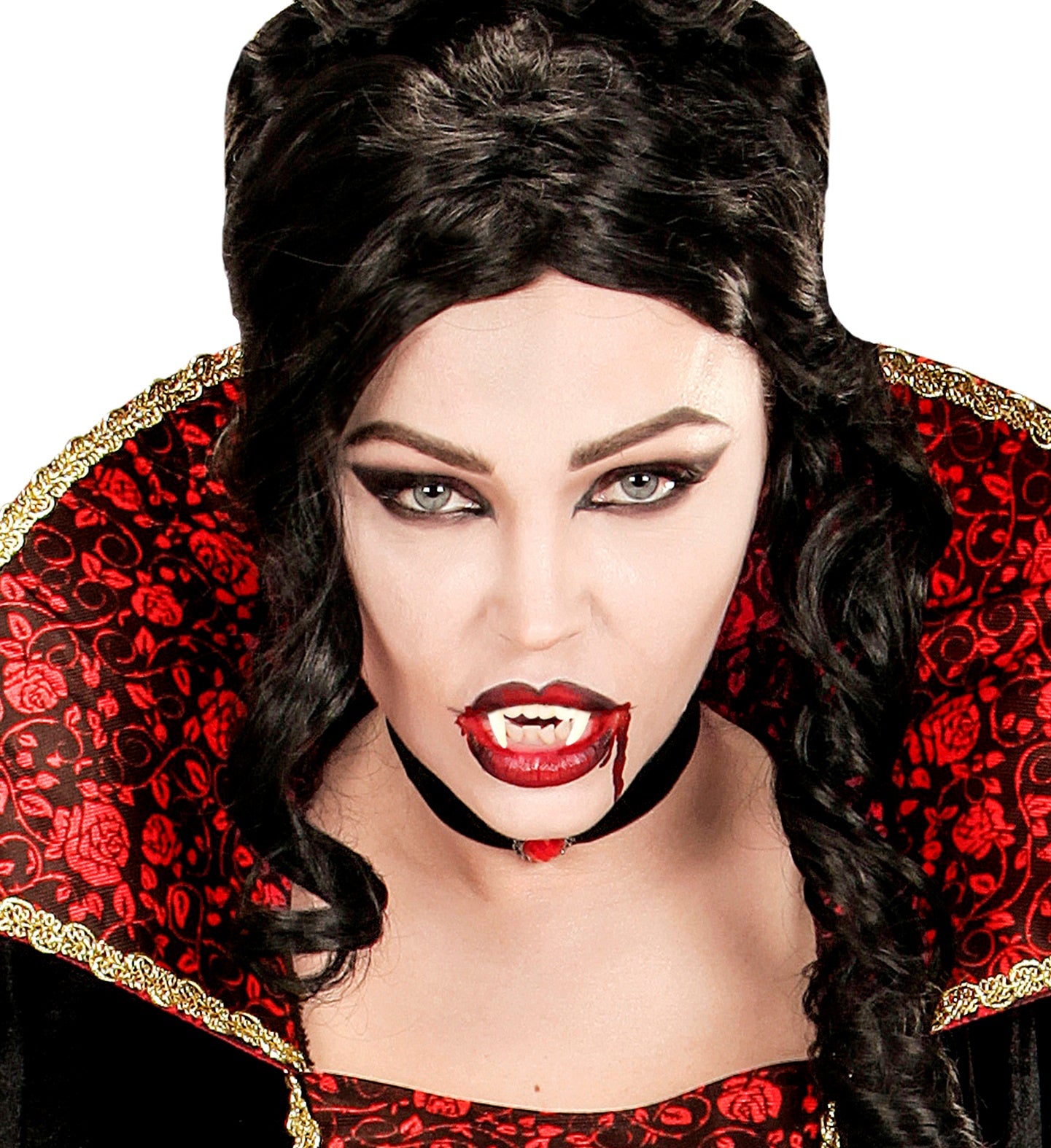A woman in a vampiress costume with a high, red and black collar, displaying a set of sharp vampire fangs with a trickle of fake blood.