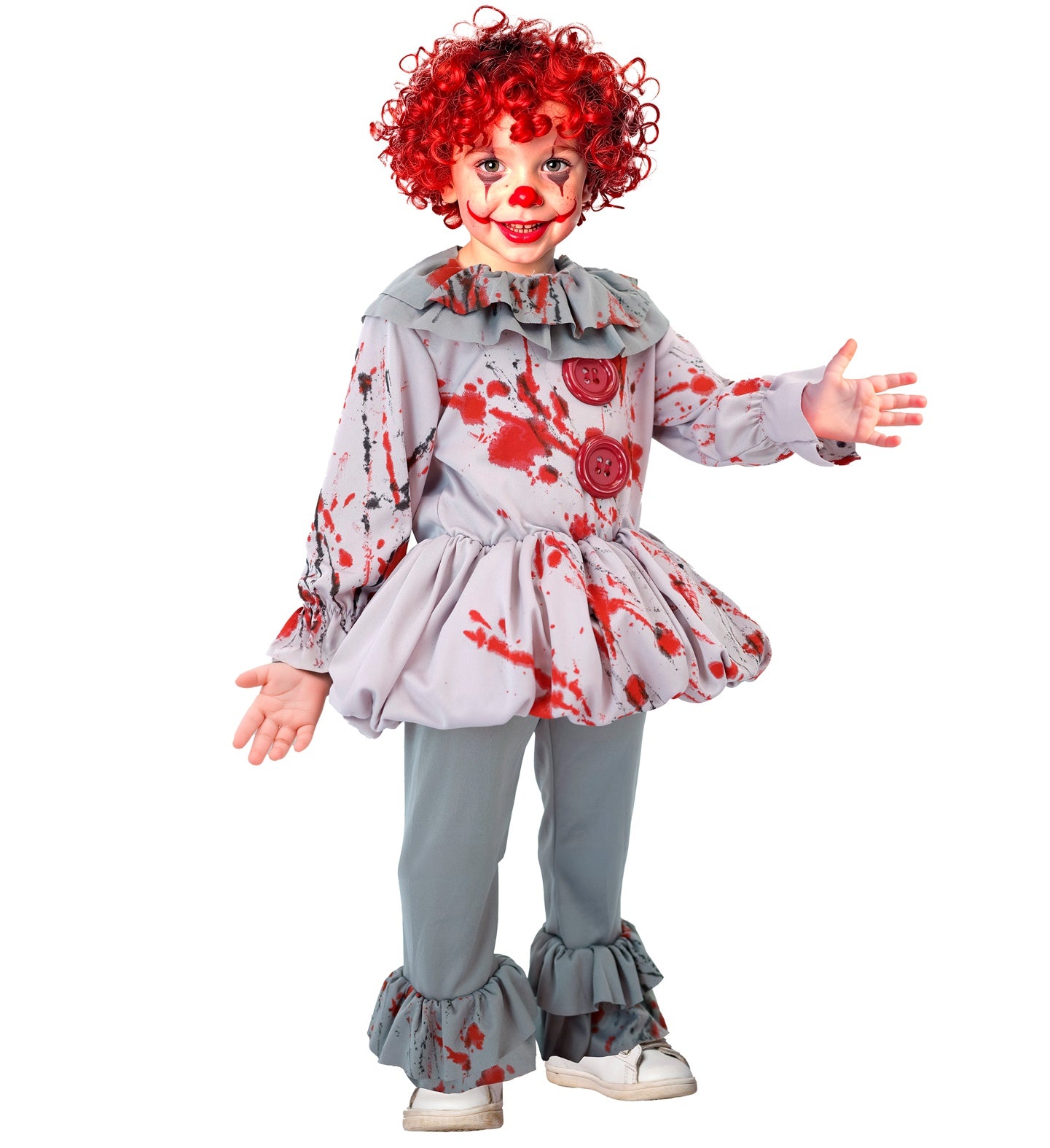 A child in a "killer clown" style costume, with a red curly wig and clown makeup, smiling and posing with arms outstretched on a white background. The costume includes a grey ruffled tunic with red blood splatter stains and grey trousers with ruffled cuffs.