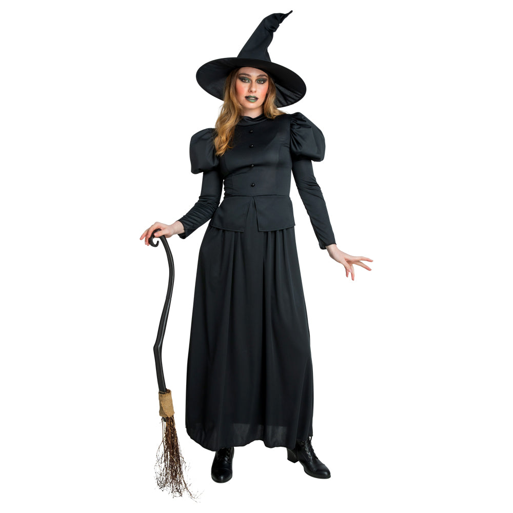 A woman models a classic Wicked Witch costume, featuring a long black dress with puff sleeves and a pointy hat, holding a prop broom.