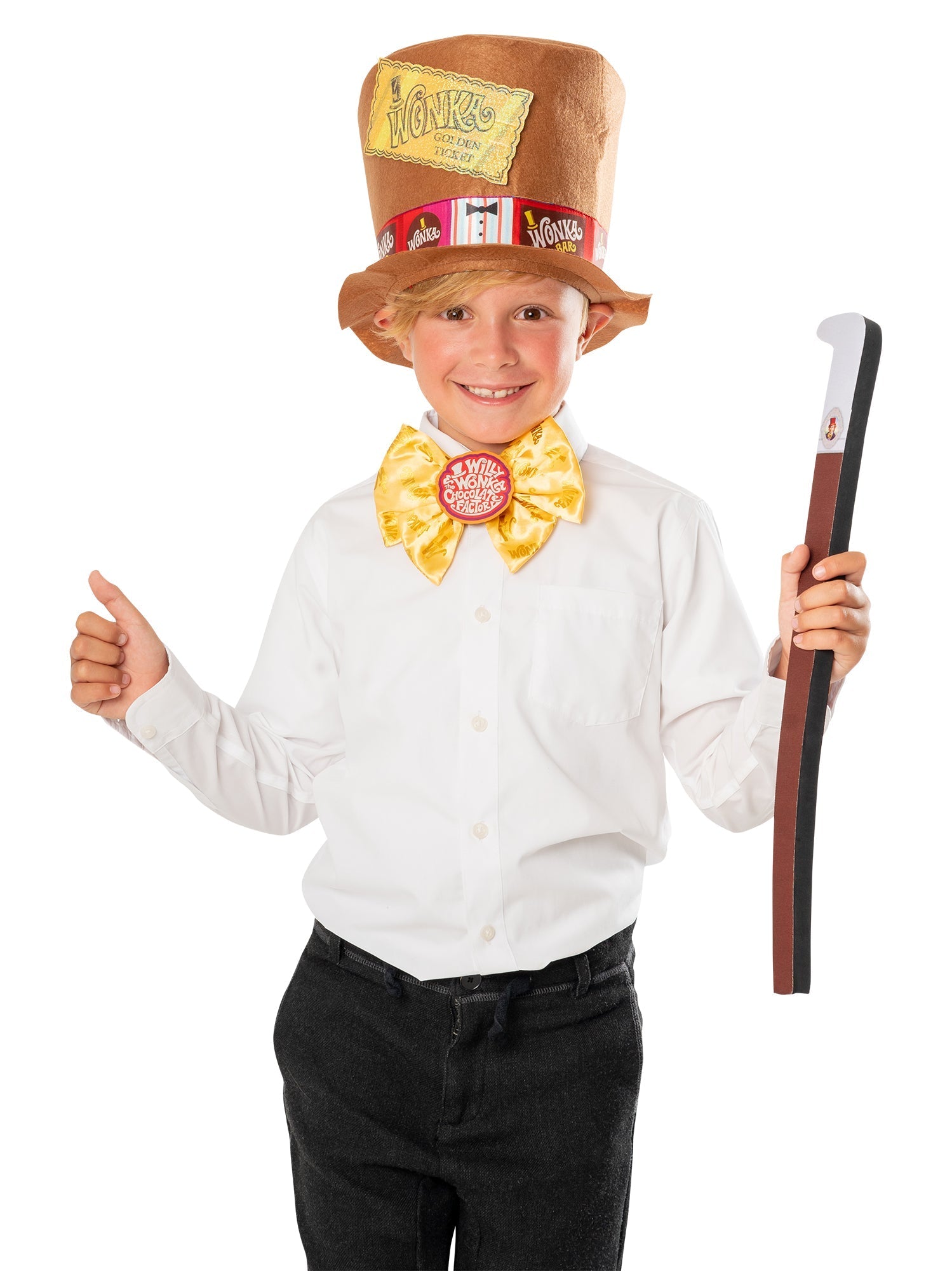 Child posing with a thumbs up wearing the official Willy Wonka top hat and yellow bowtie while holding a cane.