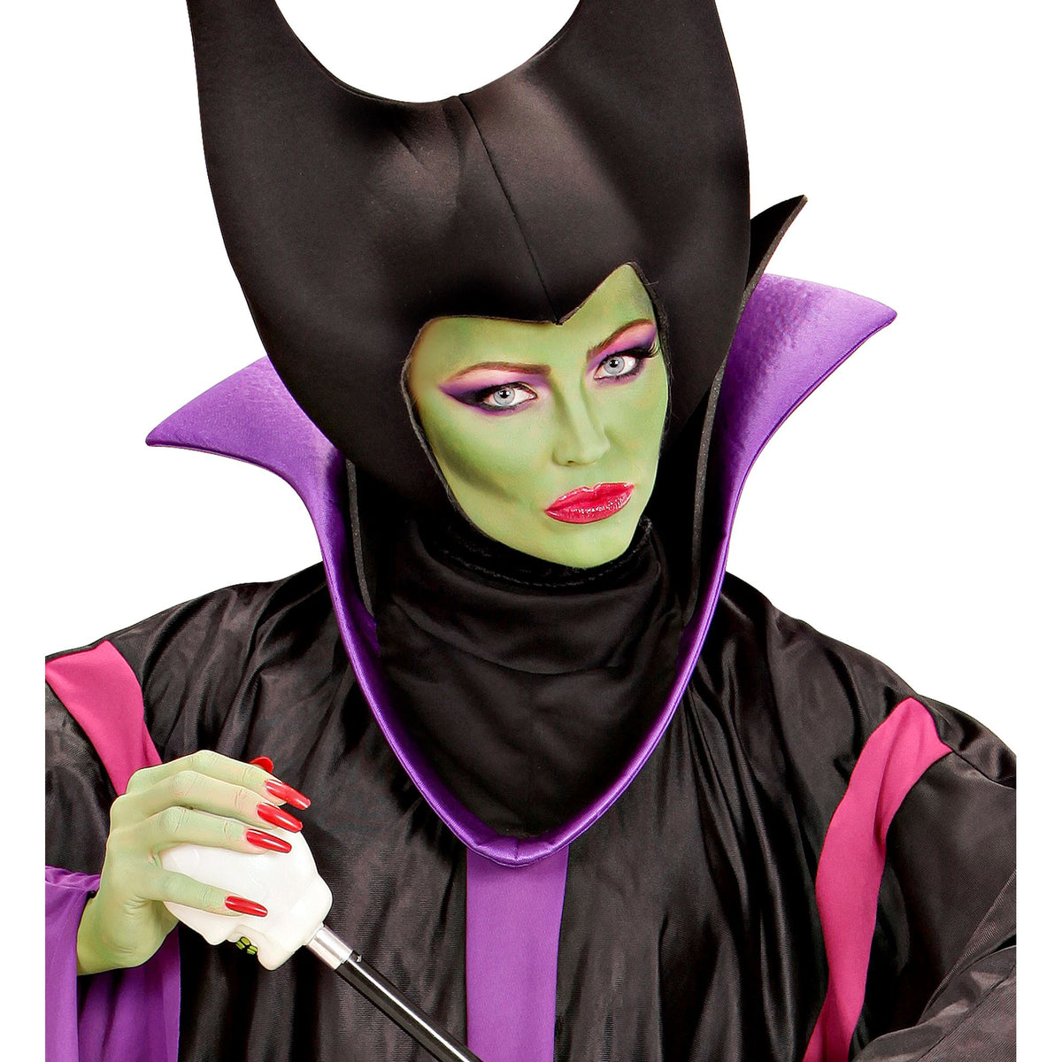 A woman wearing a horned dark fairy costume, modeling green face makeup with dramatic purple eyeshadow and red lips.