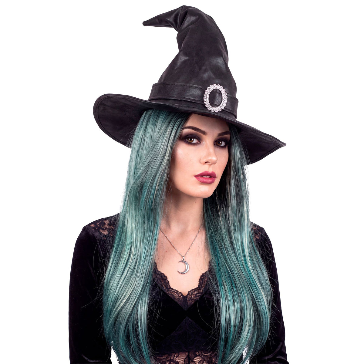 A glamorous witch costume look featuring a woman wearing a long teal wig paired with a black pointed witch hat with a silver buckle, and a dark velvet gothic top.