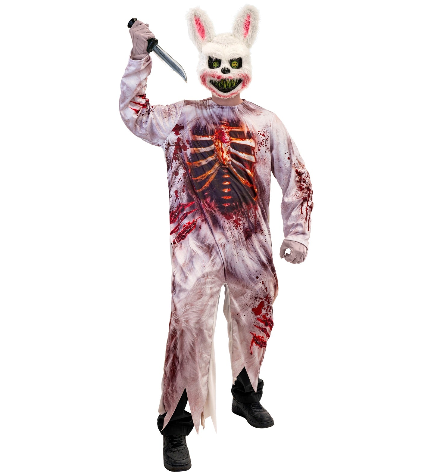 A man posing menacingly in a gory zombie rabbit fancy dress costume, wearing a bloody furry bunny mask with sharp teeth and holding a fake bloody knife.