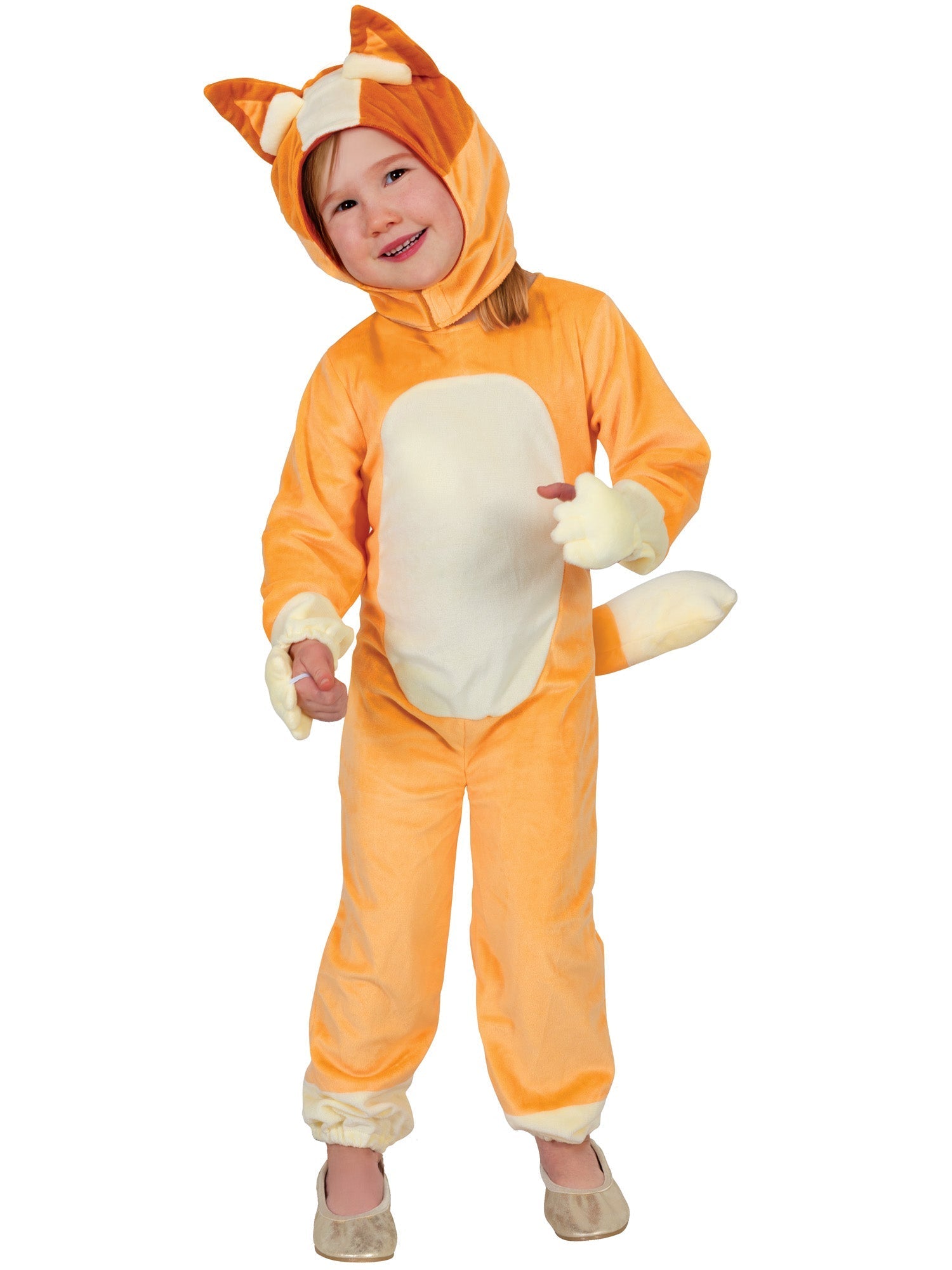 A young child wearing an orange and white Bingo costume, consisting of a full jumpsuit with an attached tail and a detachable headpiece with ears, standing and smiling happily.